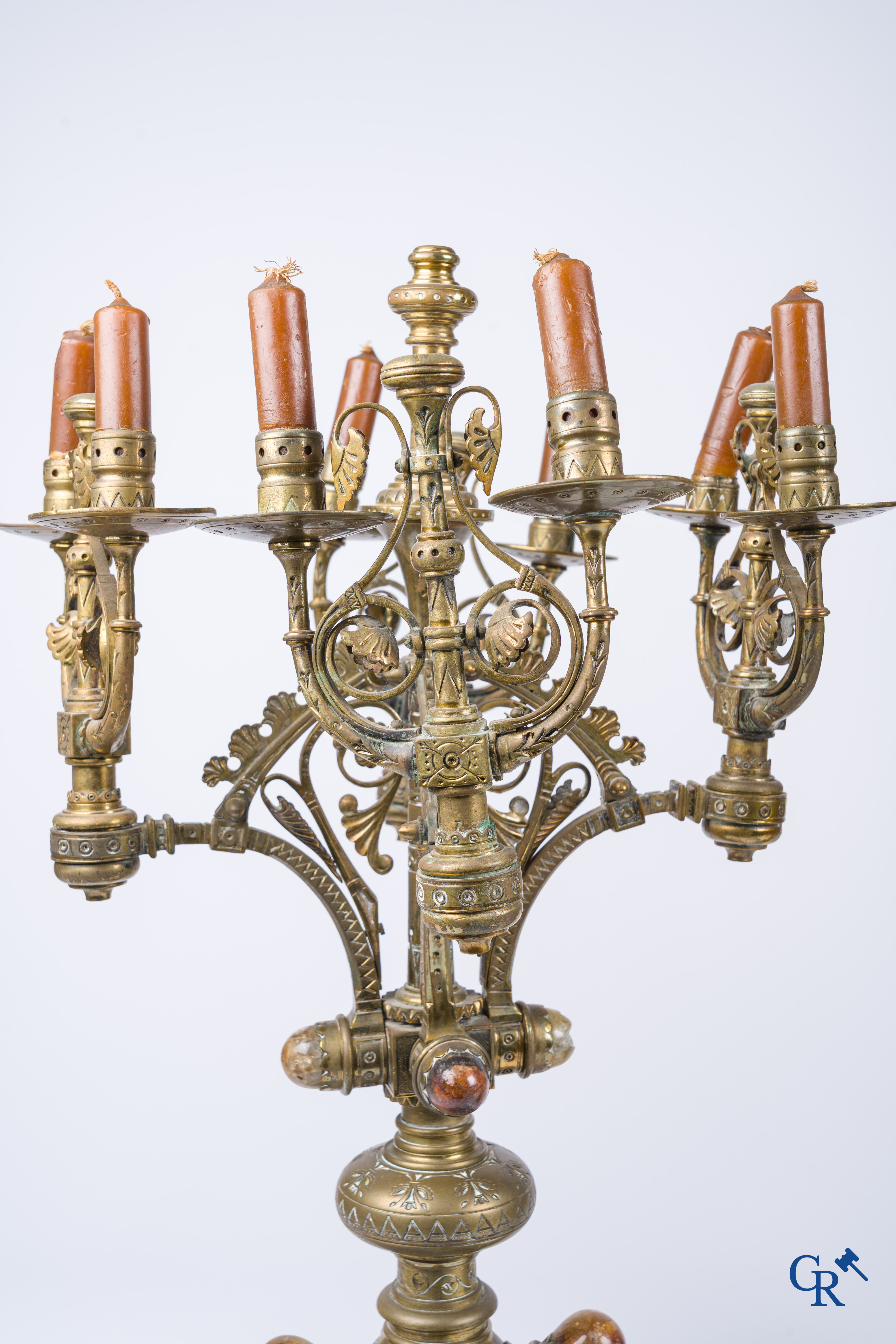 A pair of important bronze candlesticks decorated with various types of rock including amethyst. 19th century.