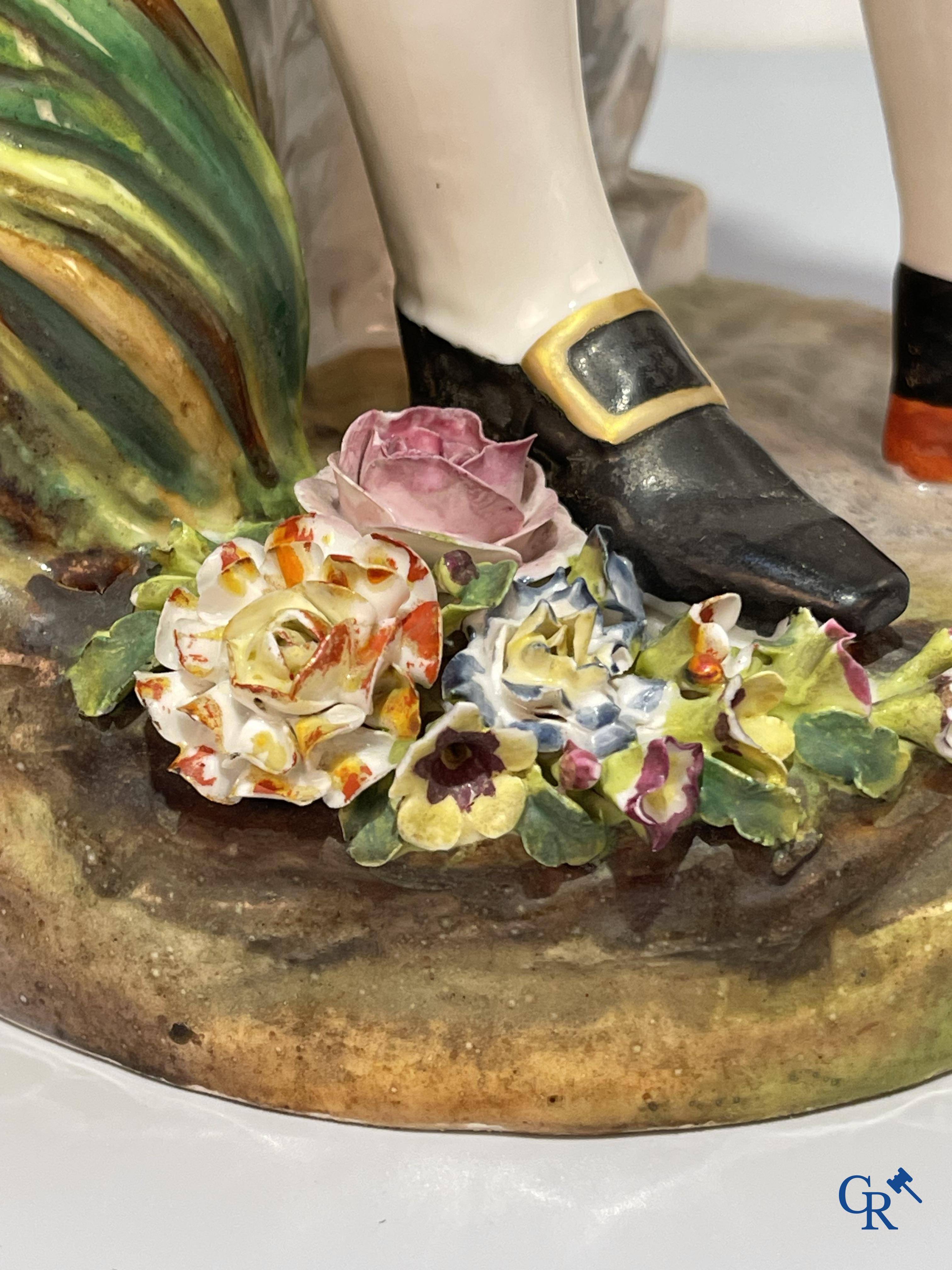 European porcelain, Meissen, a couple in finely polychromed German porcelain. Marked with the swords.