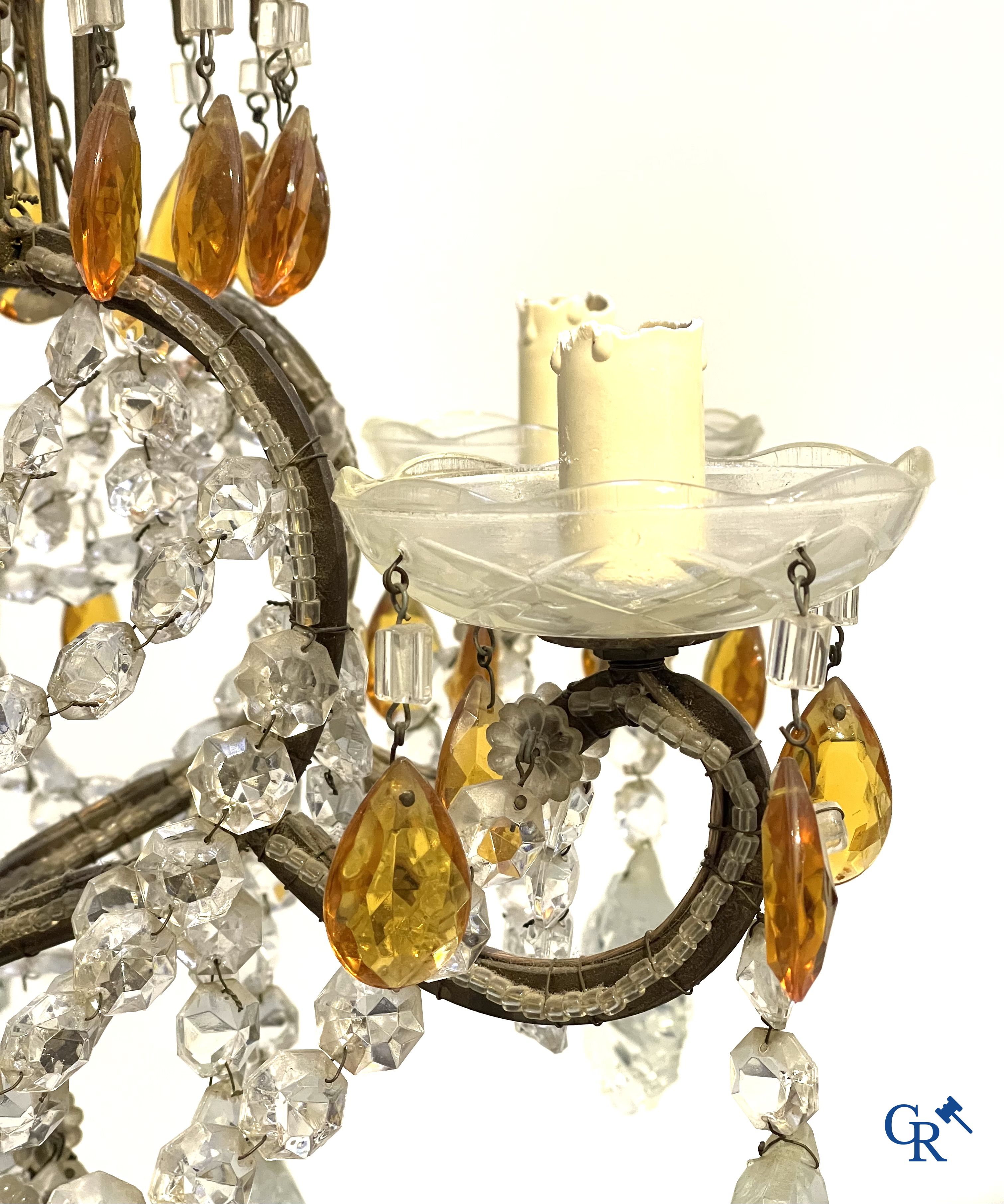 A large chandelier in crystal with double pearls on the frame.