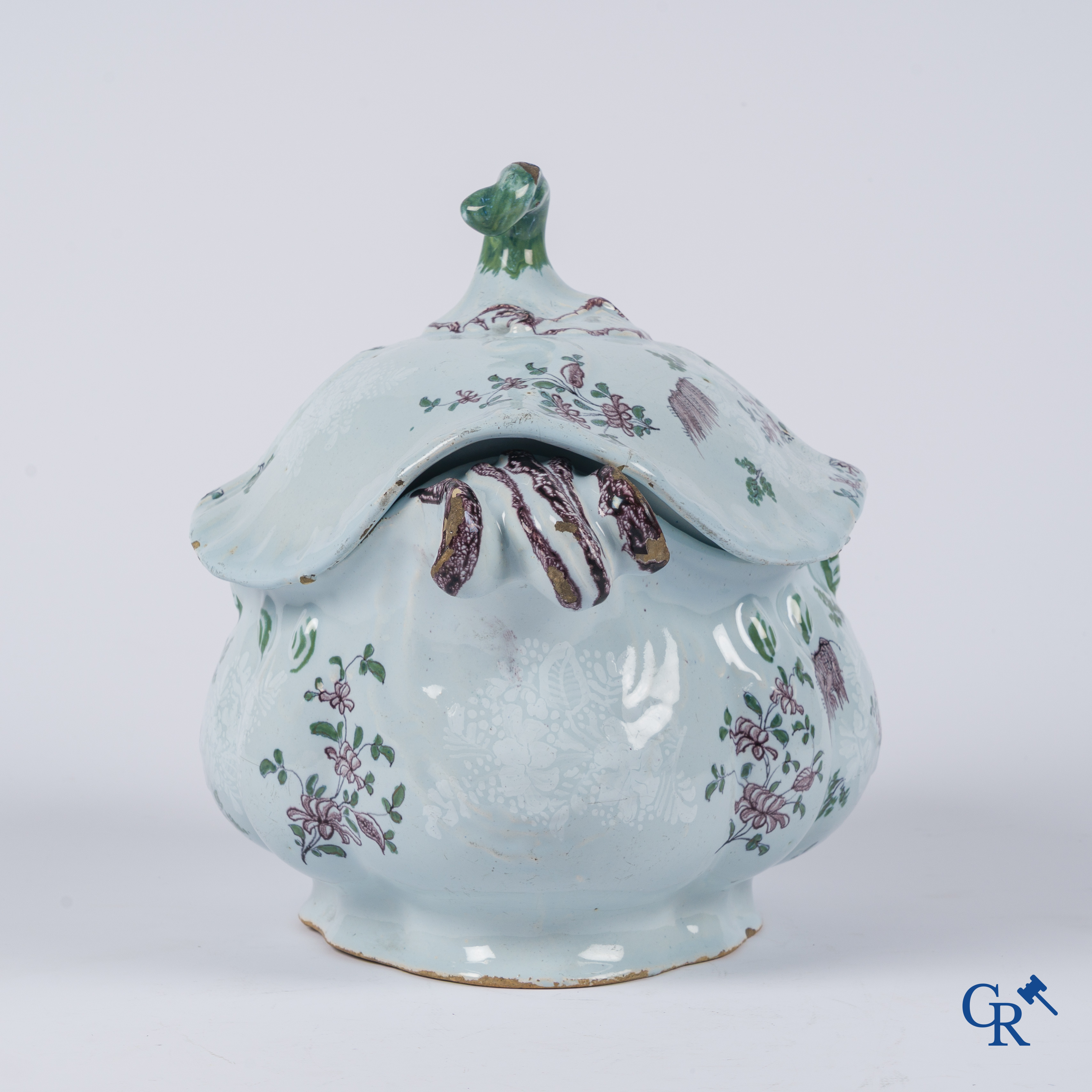 Earthenware. A large 18th century tureen and its lid in enamelled faience.