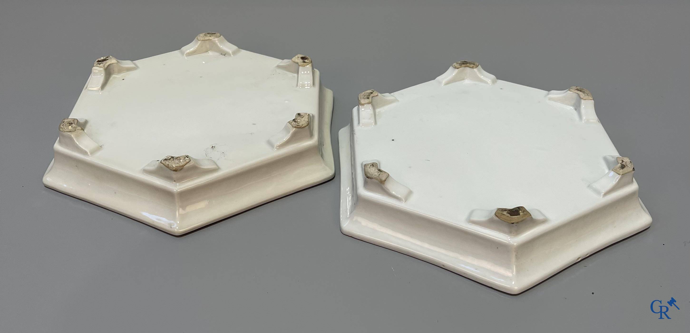 Asian Art, Chinese porcelain, a pair of hexagonal Chinese famille rose jardinieres. 19th century.