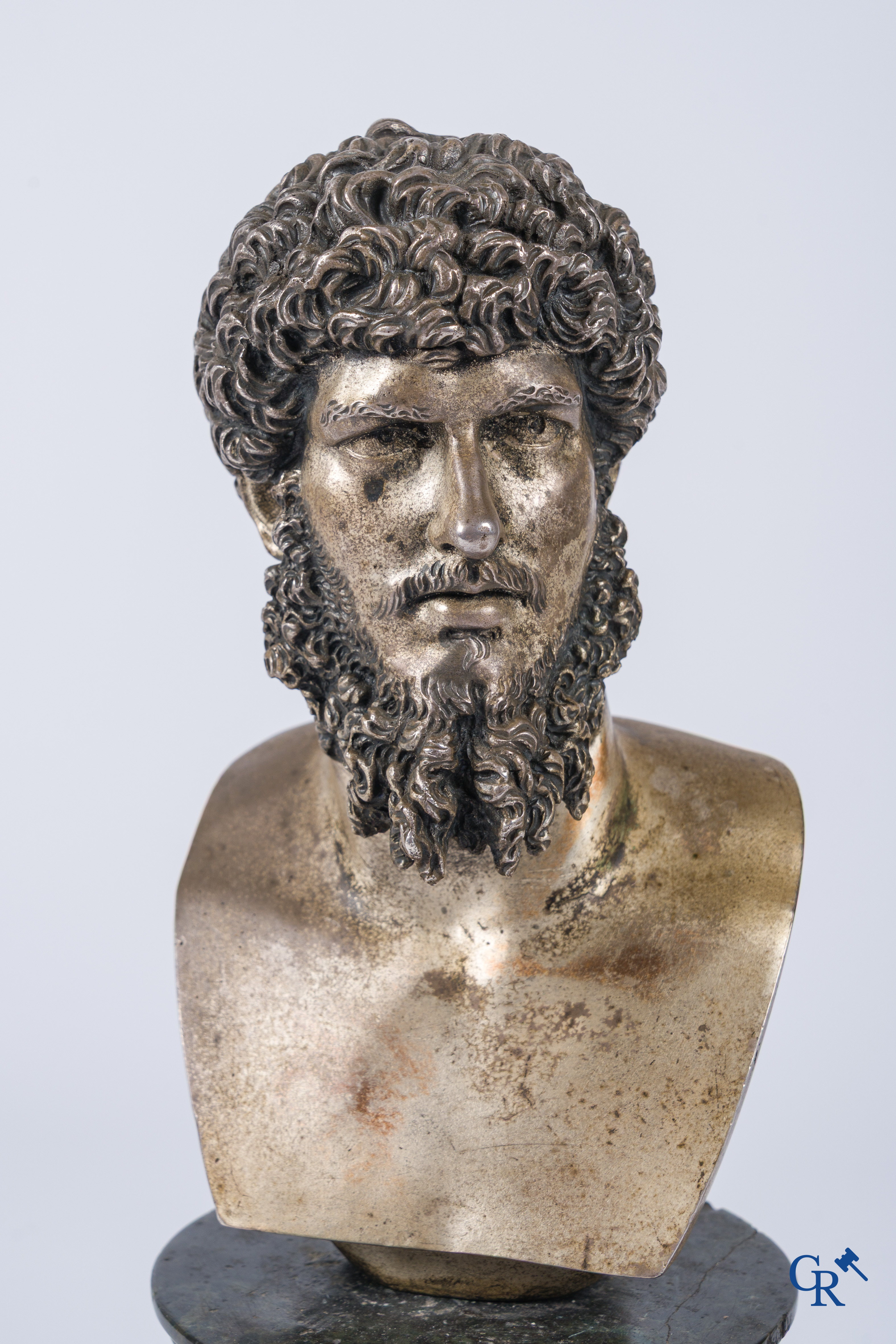 A silvered bronze bust of Lucius Verus on a dark green serpentine pedestal. 19th century.