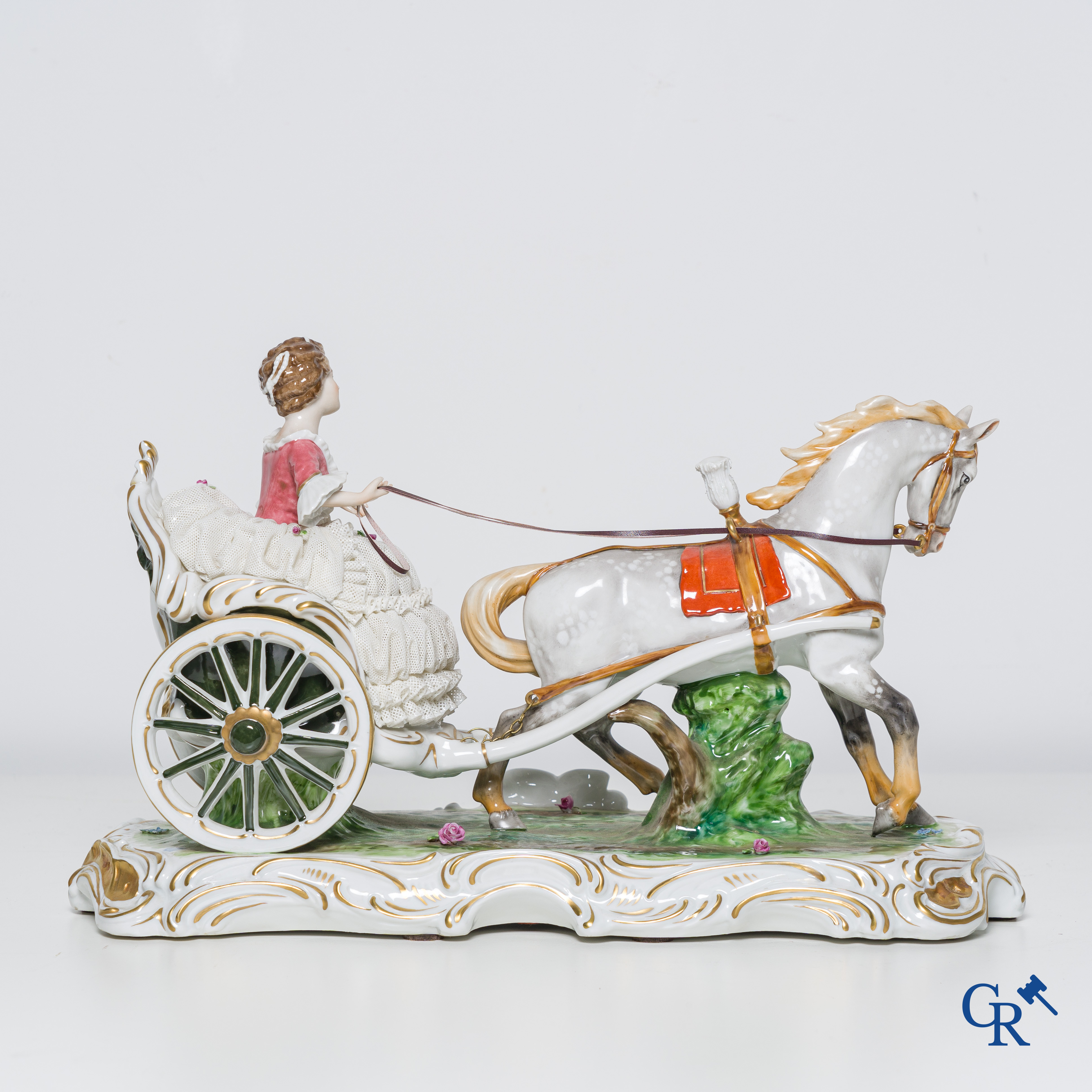 German porcelain, a group in Volkstedt porcelain. Elegant lady in a carriage.
