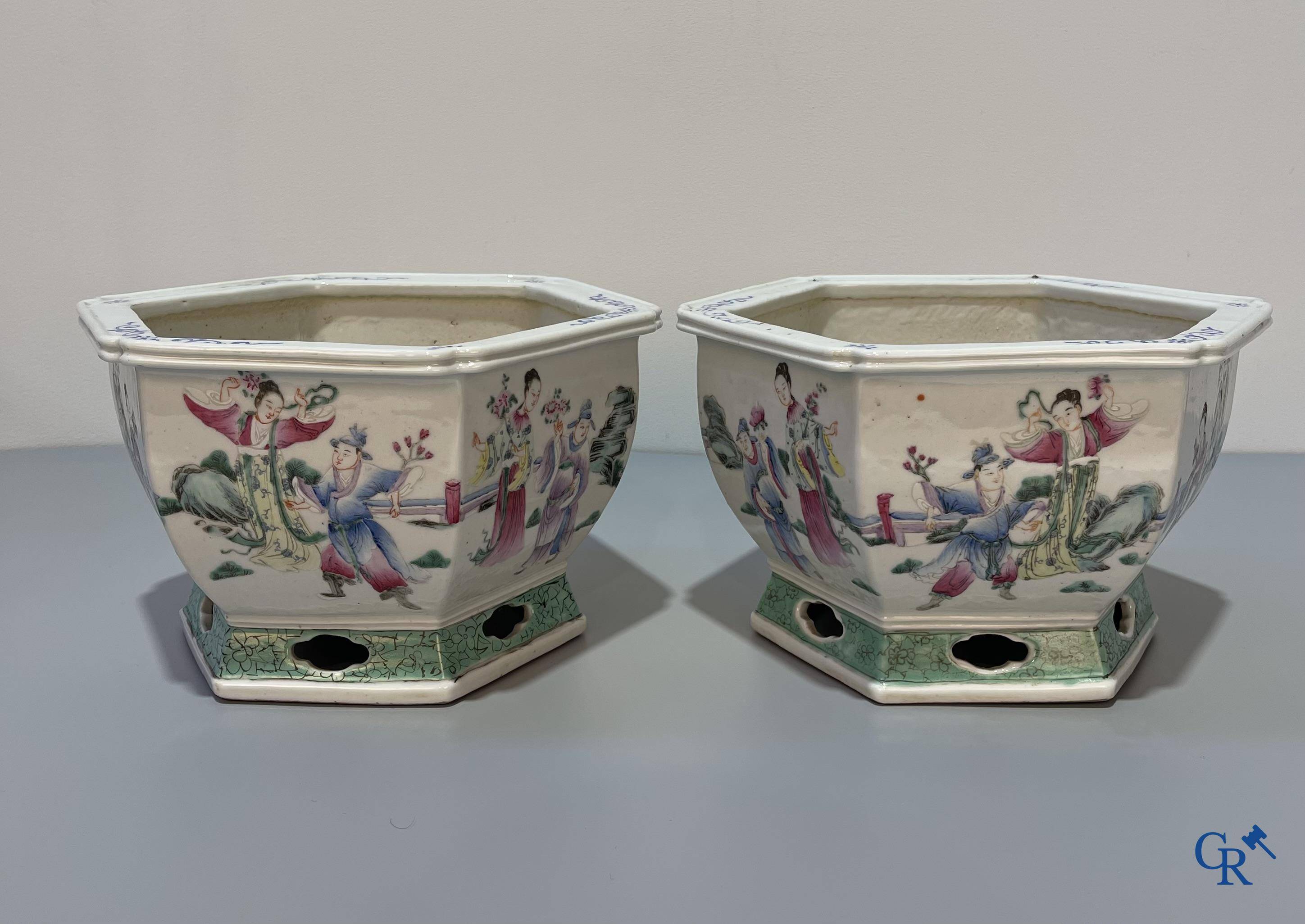 Asian Art, Chinese porcelain, a pair of hexagonal Chinese famille rose jardinieres. 19th century.