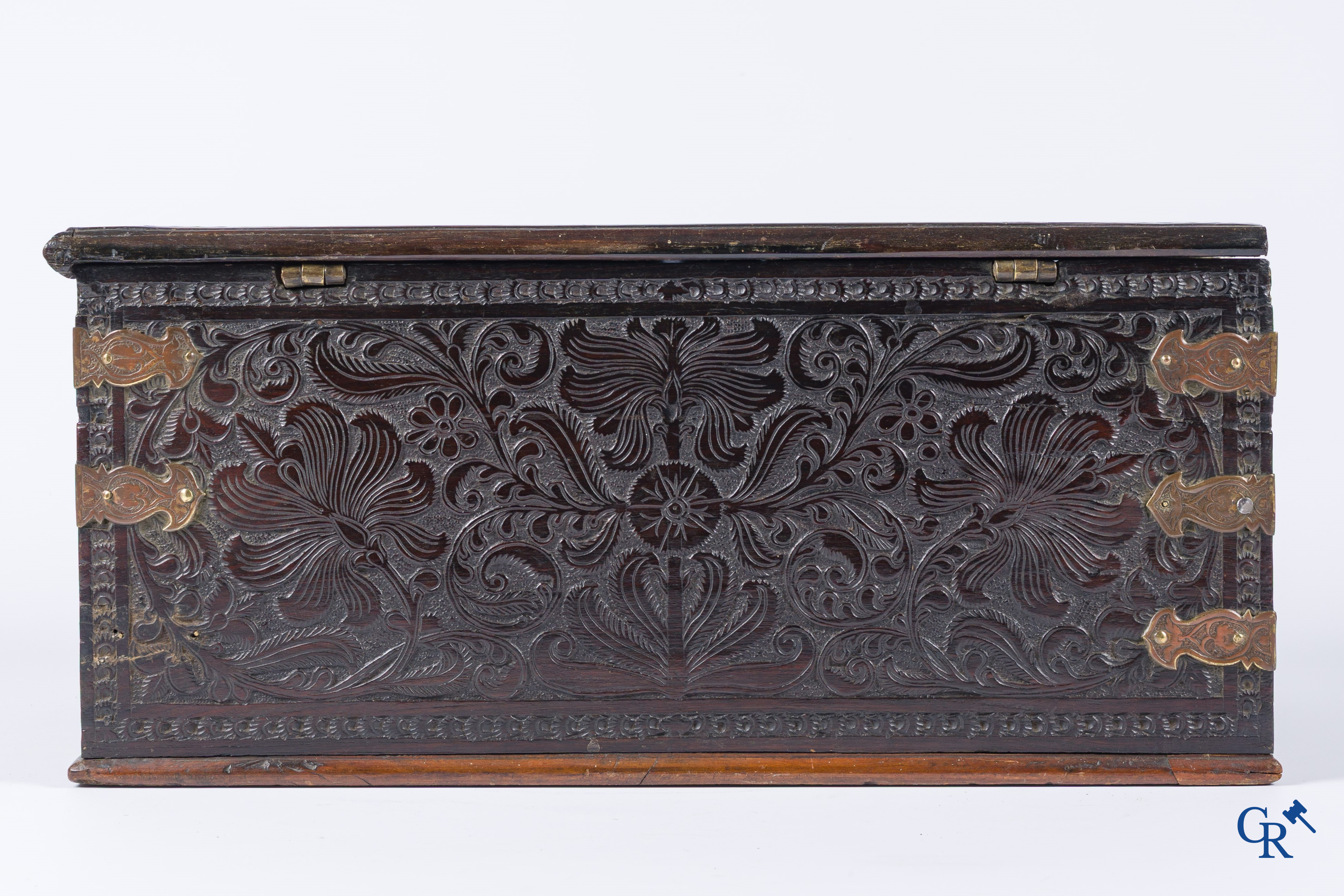 A finely carved colonial small trunk in exotic wood and bronze mounts. 17th-18th century.