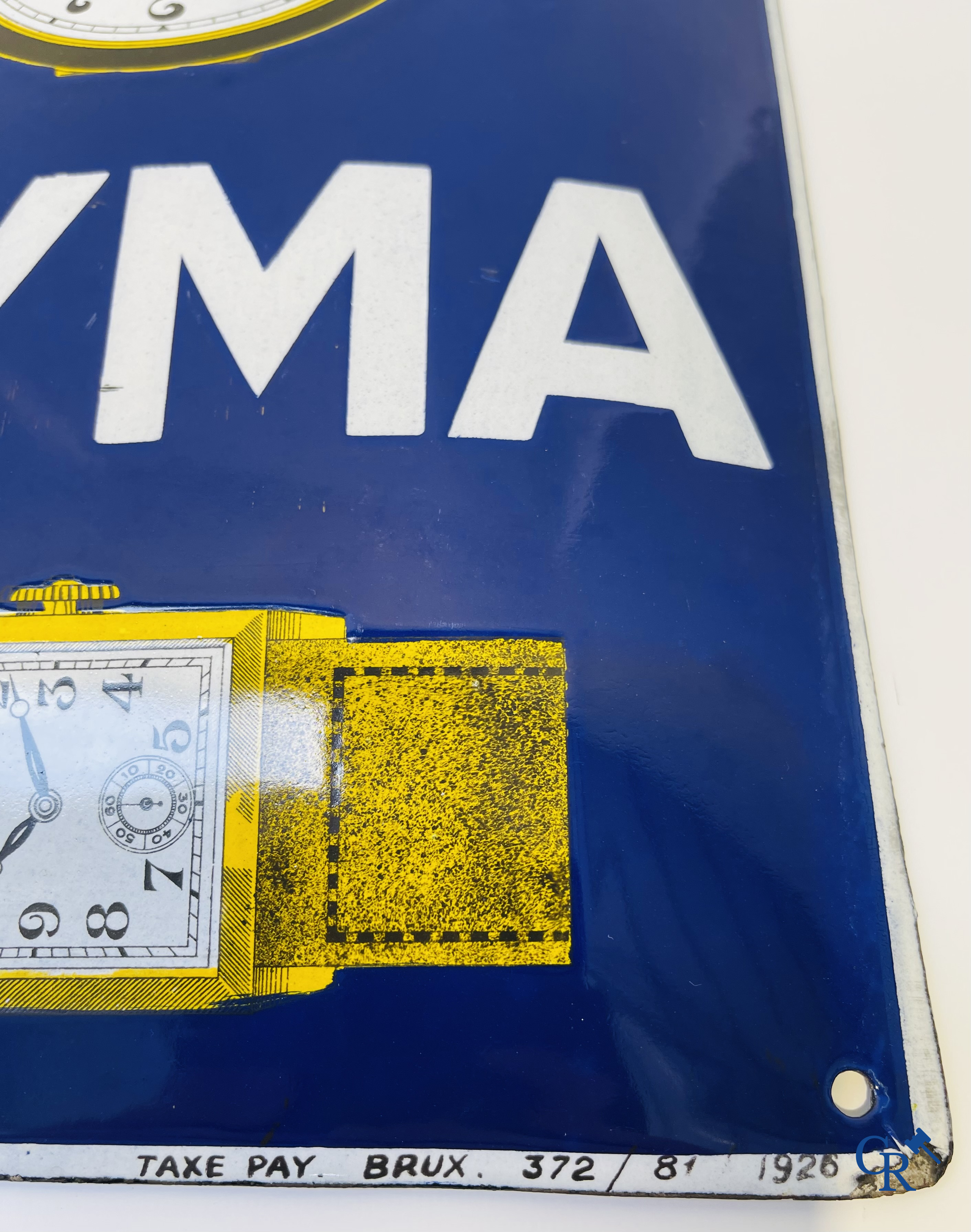 Tavannes Watch Company. Bombed enamel advertising sign for Cyma wrist and pocket watches. 1926.