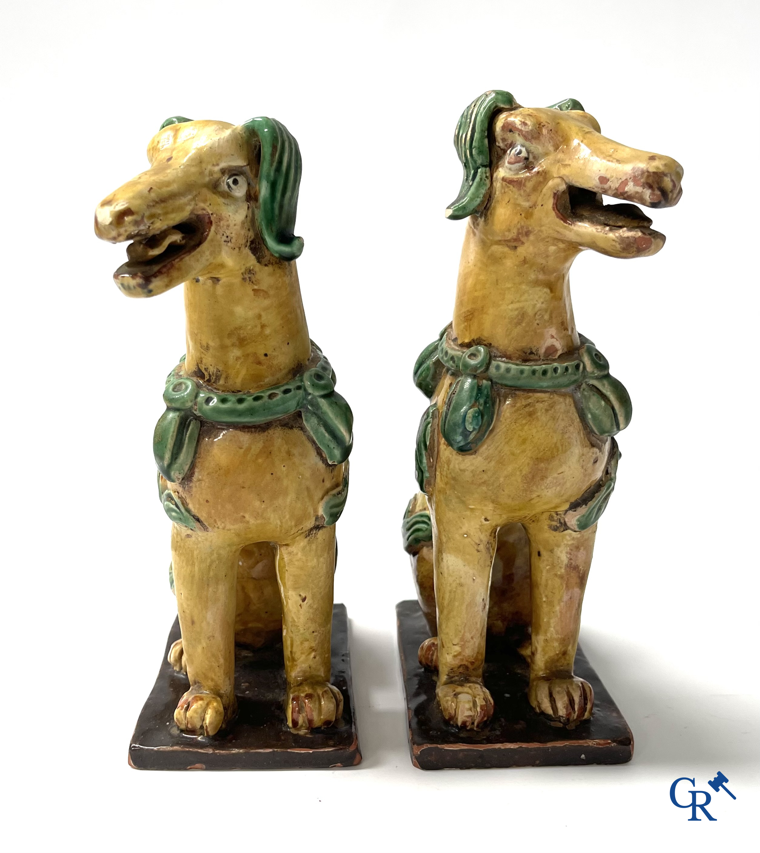 Asian Art, Chine. A pair of seated enamelled terra cotta dogs.