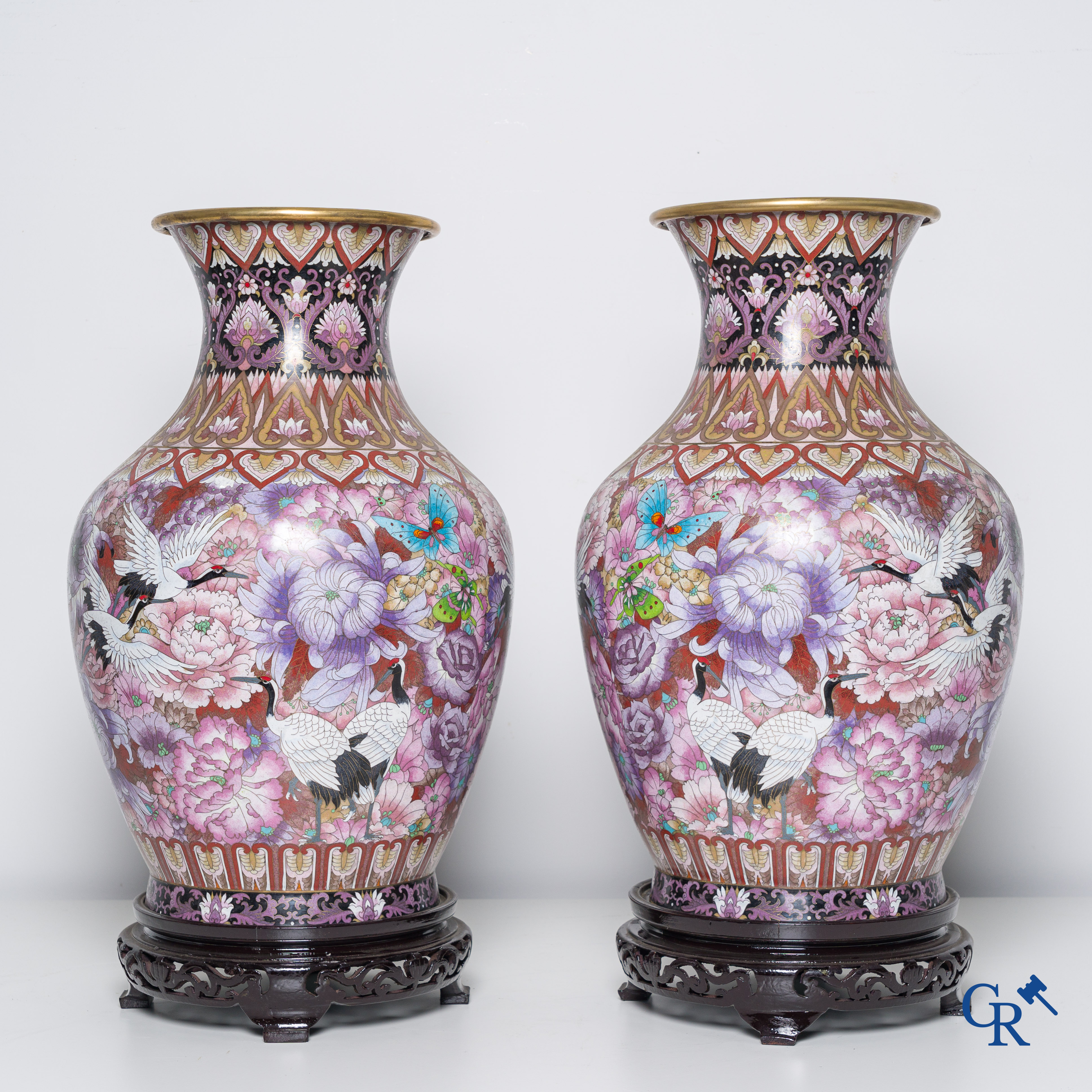 Asian Art, a pair of cloisonné vases with flowers, butterflies and cranes. 20th century.