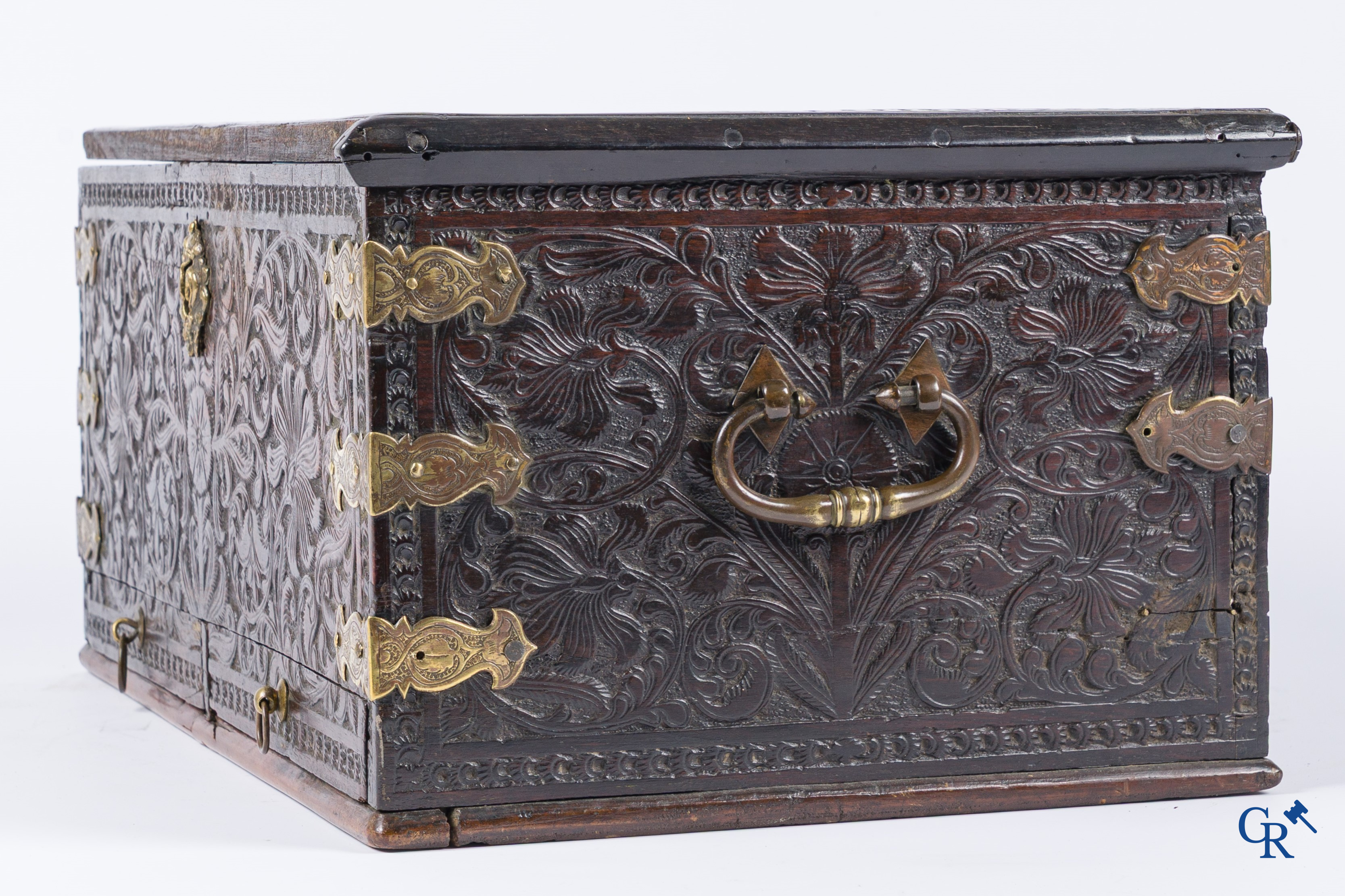 A finely carved colonial small trunk in exotic wood and bronze mounts. 17th-18th century.