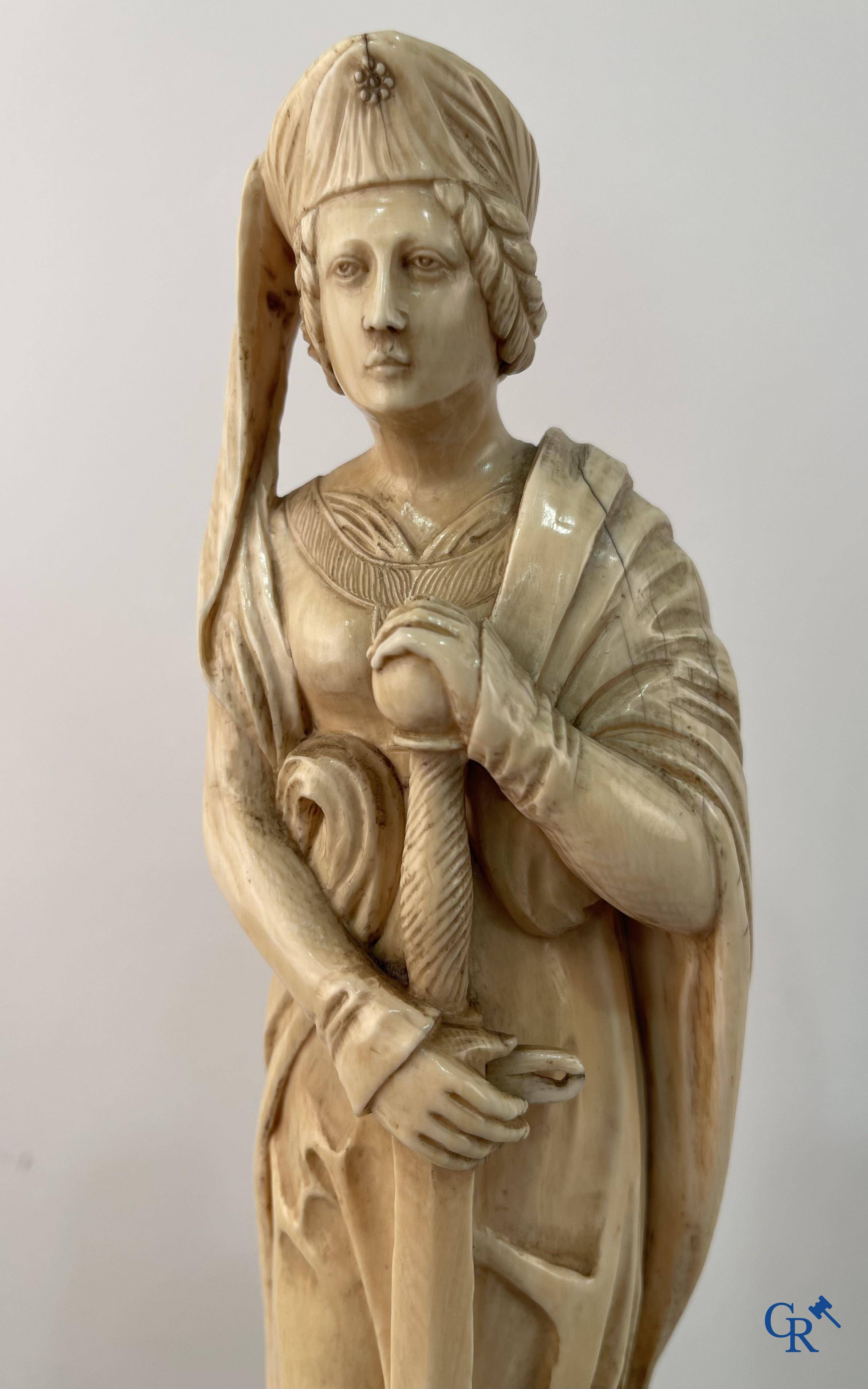 Dieppe, French work, early 19th century. Representation of Catherine of Alexandria in ivory on a pedestal.