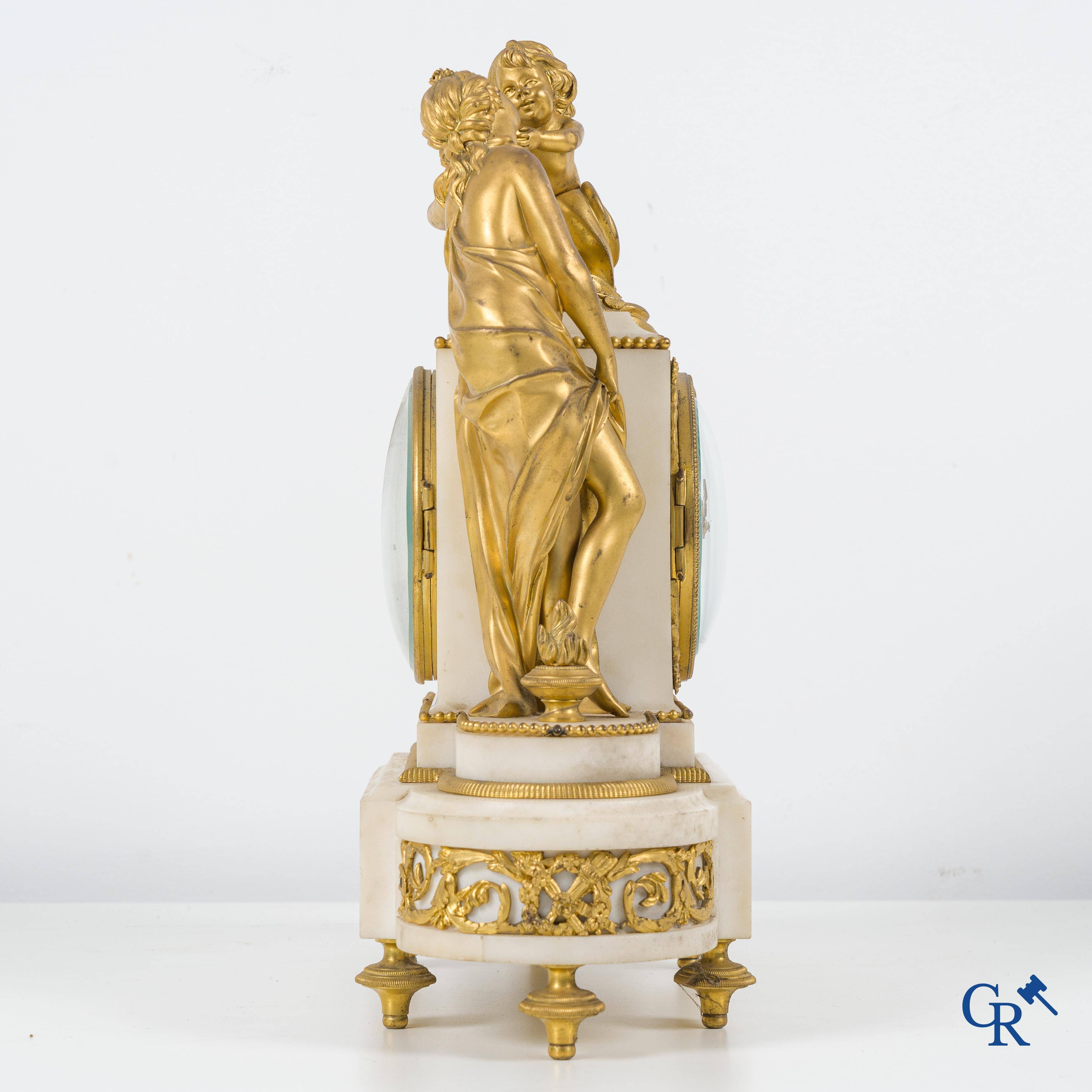 A finely chiseled and gilded LXVI-style clock in marble and bronze. circa 1880.