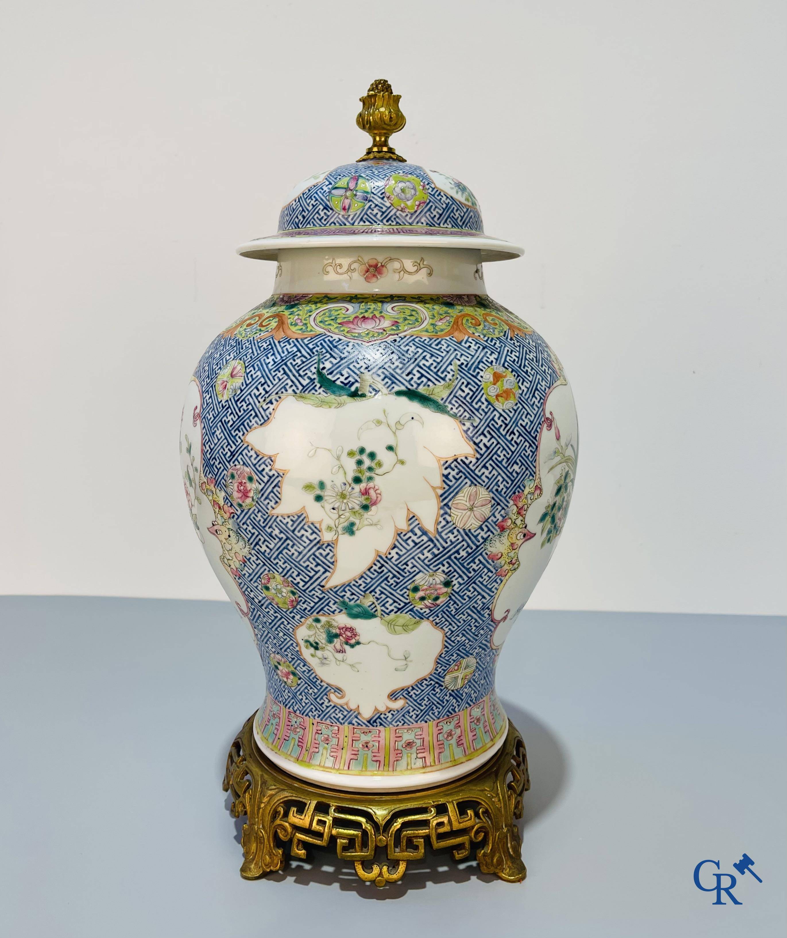 Asian Art, Chinese porcelain, a finely decorated Chinese famille rose vase with bronze. 19th century.