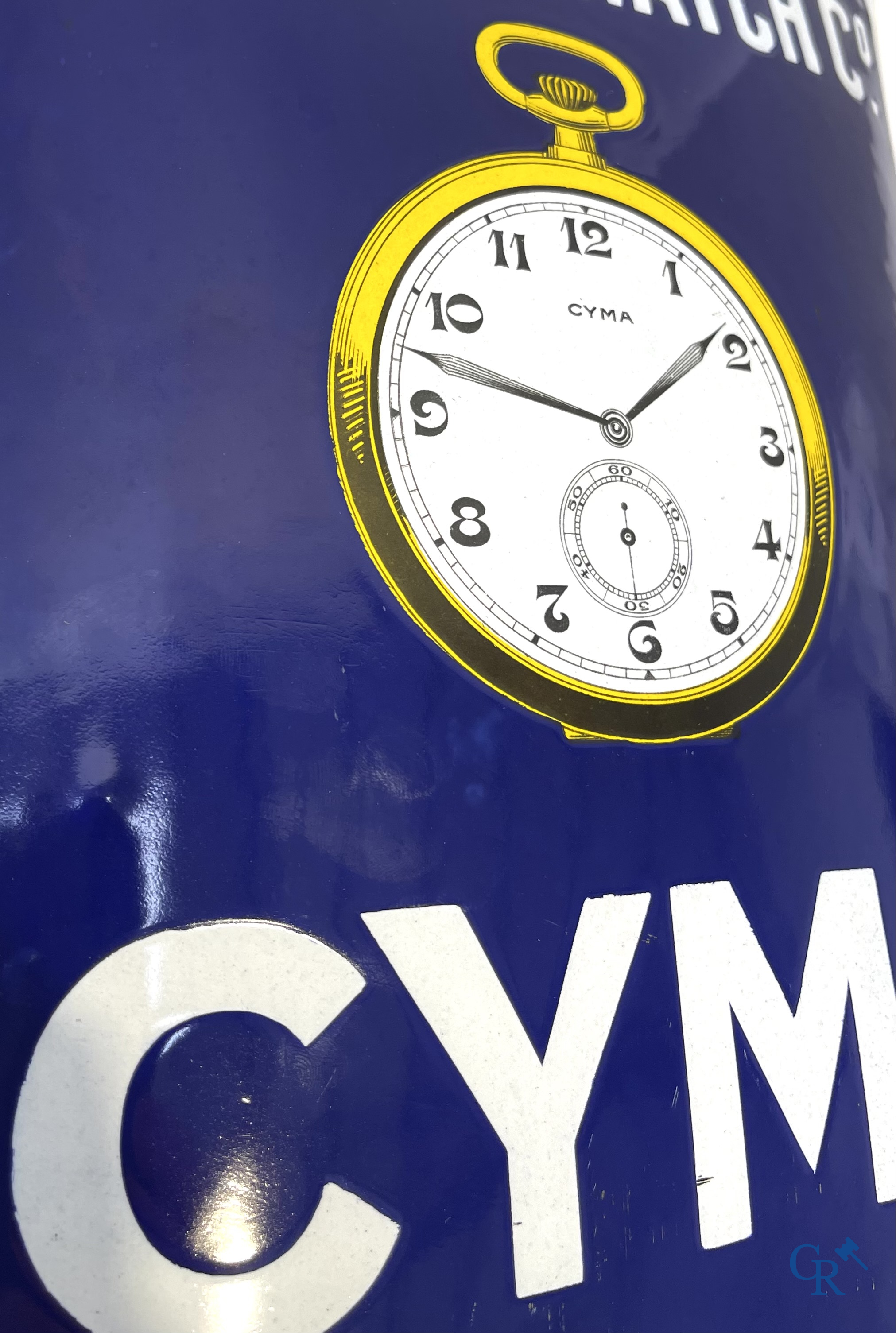 Tavannes Watch Company. Bombed enamel advertising sign for Cyma wrist and pocket watches. 1926.