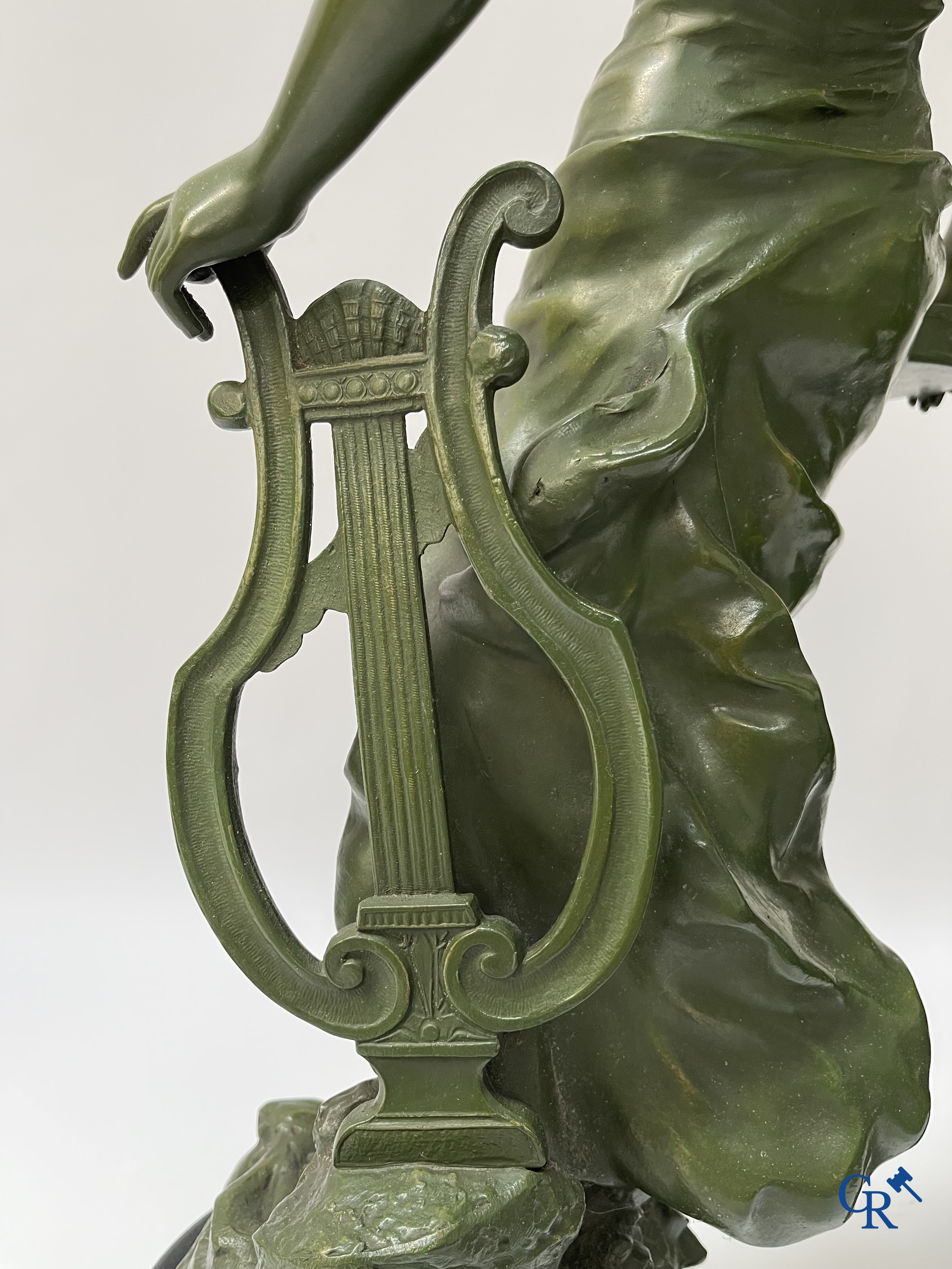 Louis & François Moreau, A large pair of statues in green patinated spelter on a wooden base. Signed L&F Moreau.