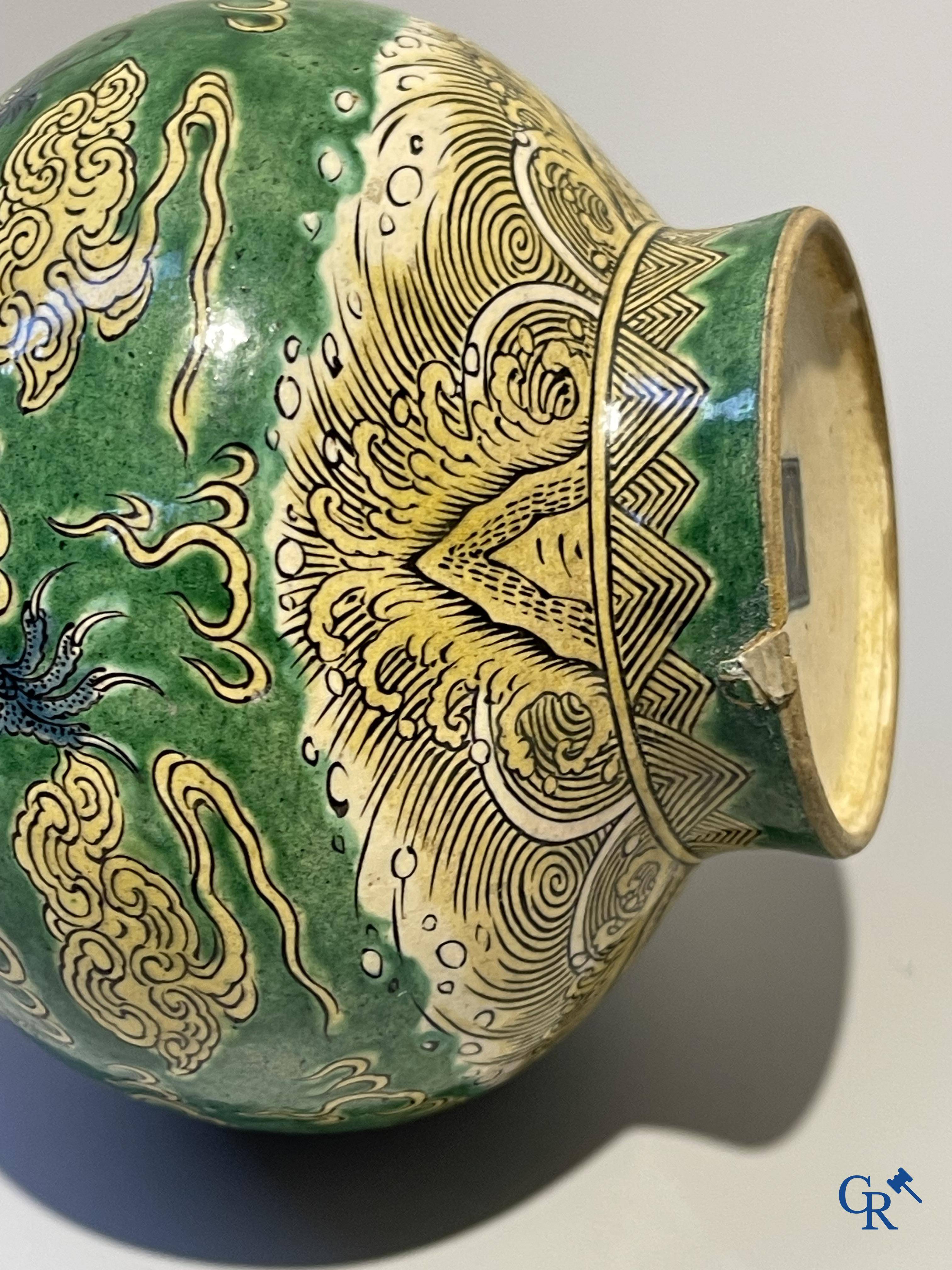 Asian Art, A fine Chinese green and yellow biscuit vase with dragon decor. Marked.