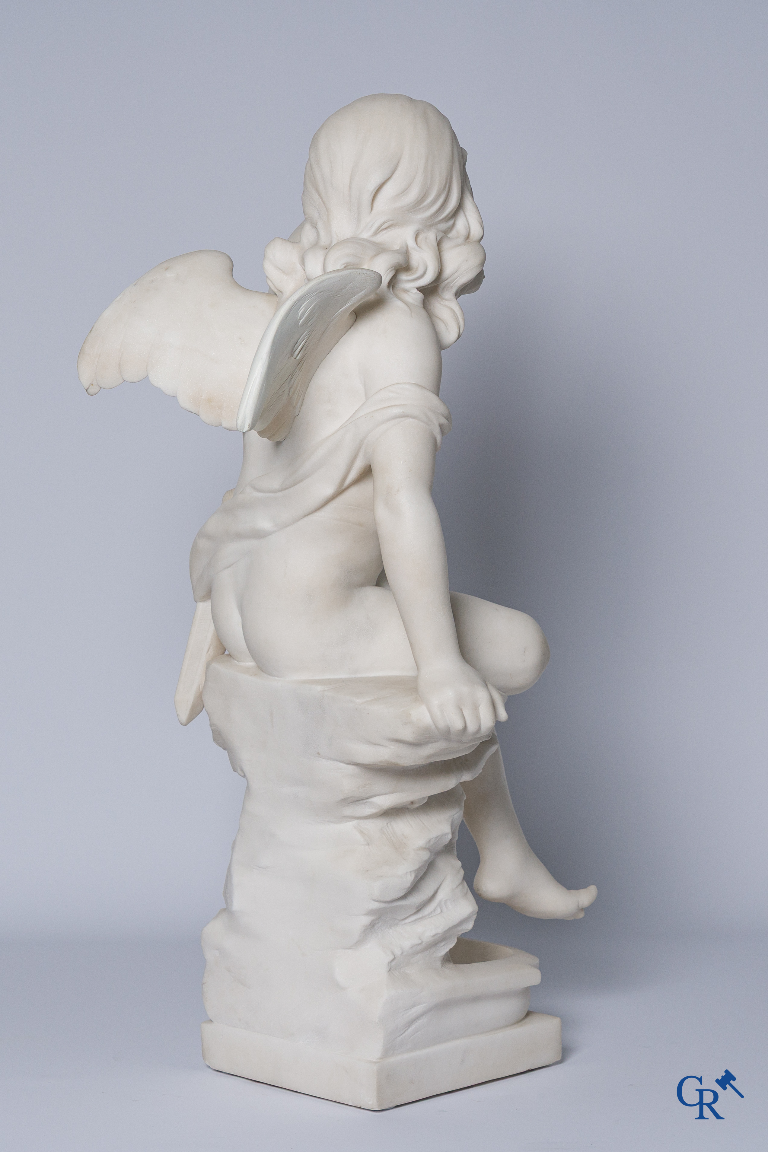 G. Tosi, Beautiful statue in carved marble, seated cupid at wall fountain. Circa 1900.