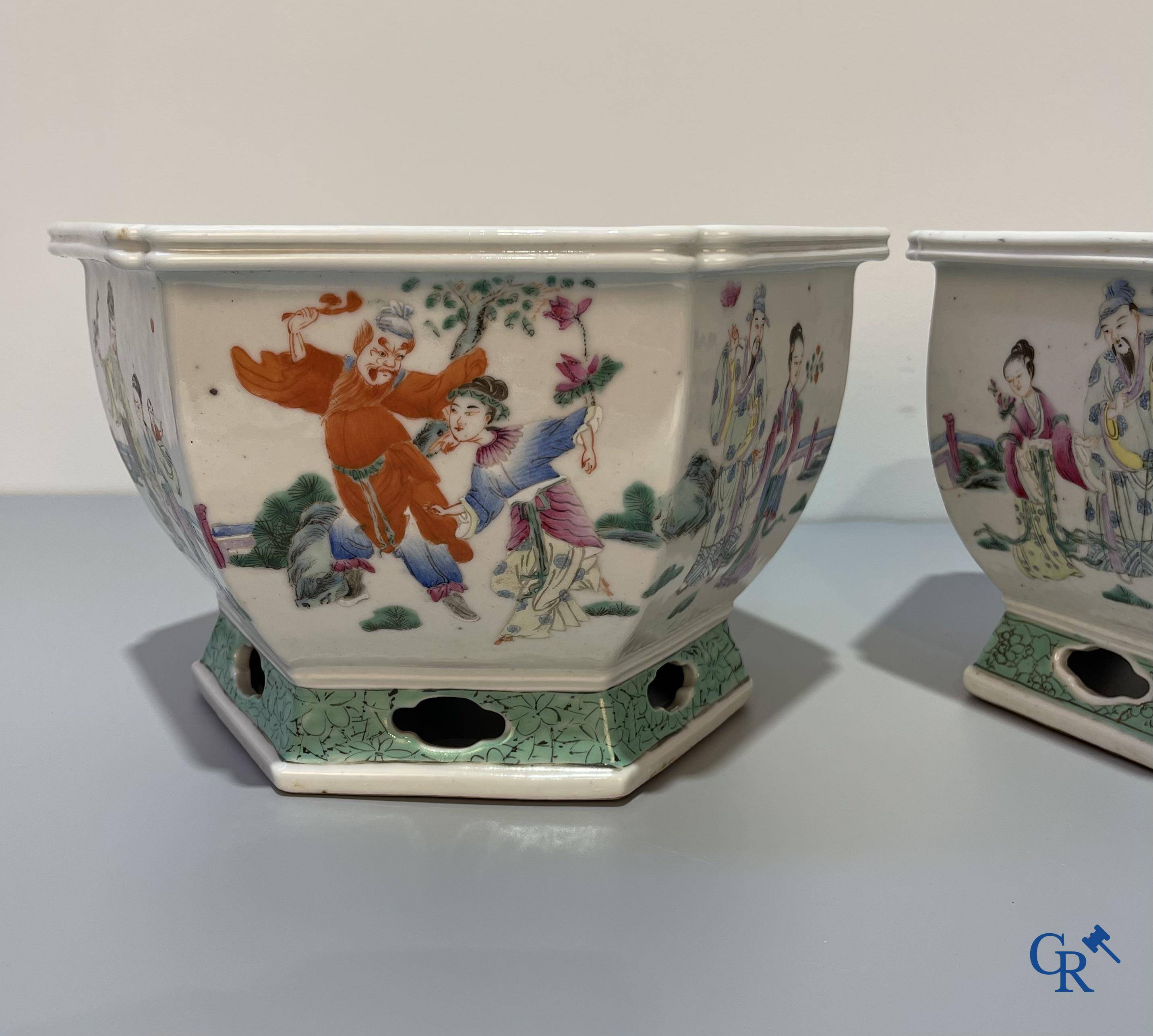 Asian Art, Chinese porcelain, a pair of hexagonal Chinese famille rose jardinieres. 19th century.
