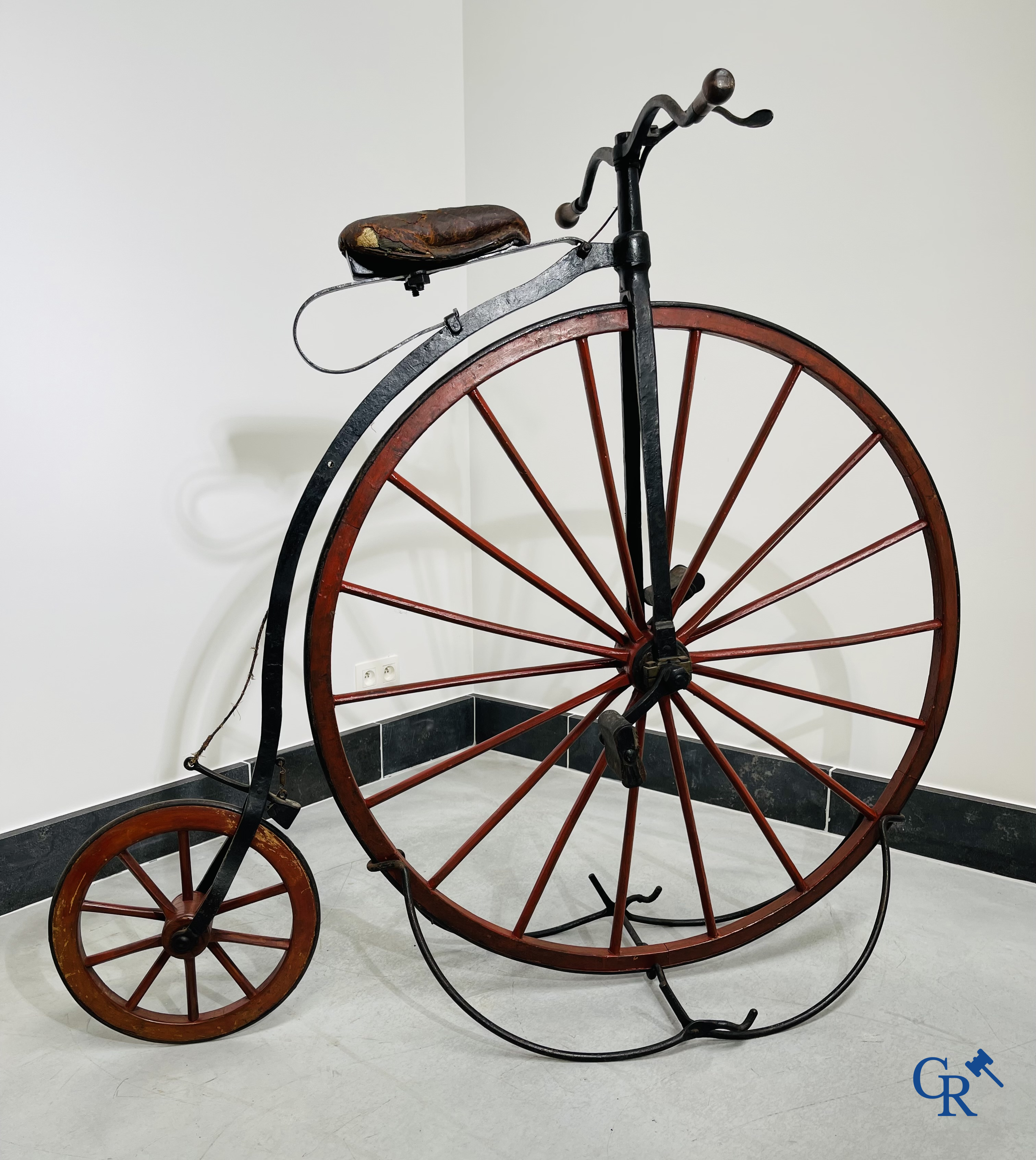 Penny-farthing with wooden spoked wheels on the original wrought iron upright. Circa 1880.