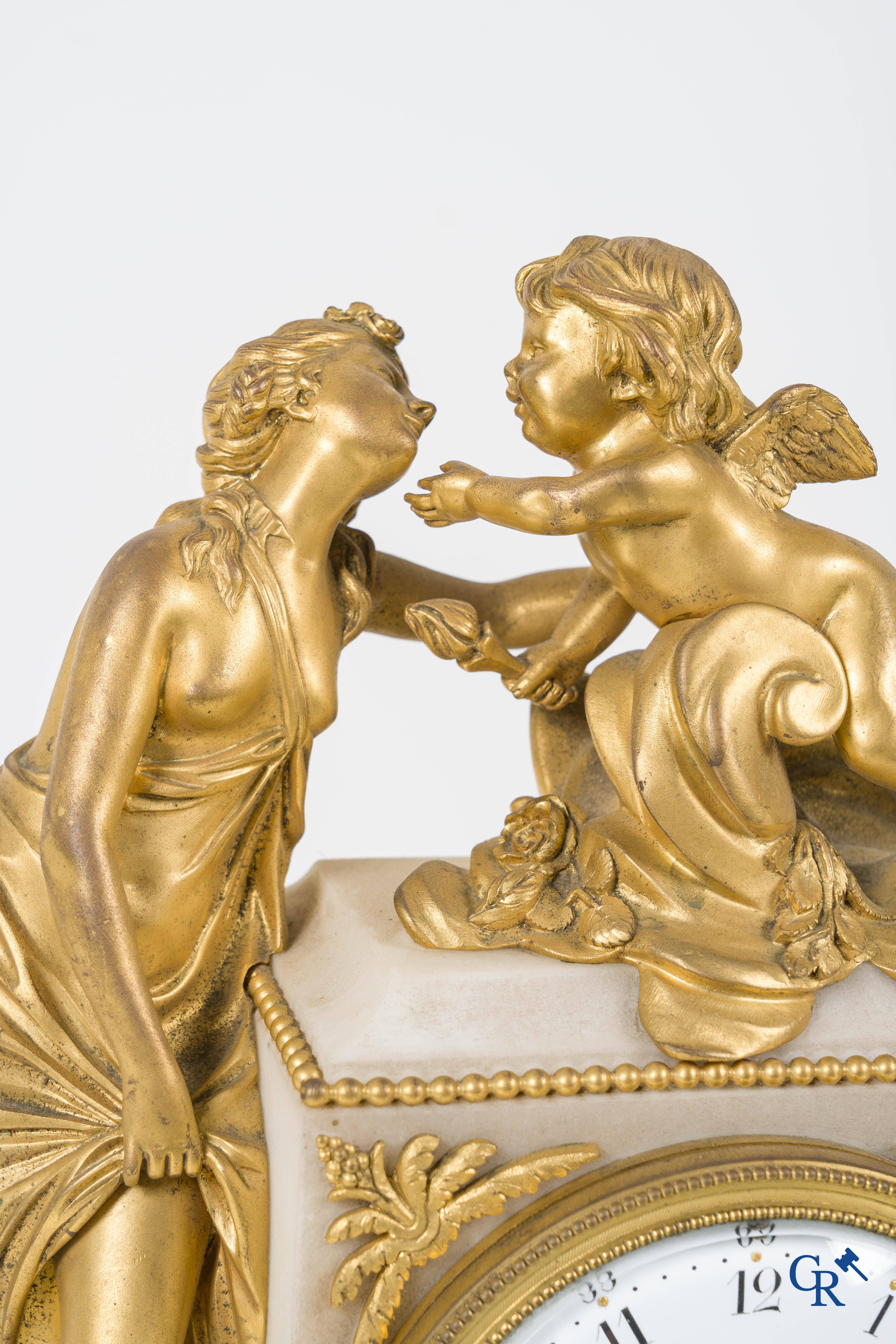 A finely chiseled and gilded LXVI-style clock in marble and bronze. circa 1880.