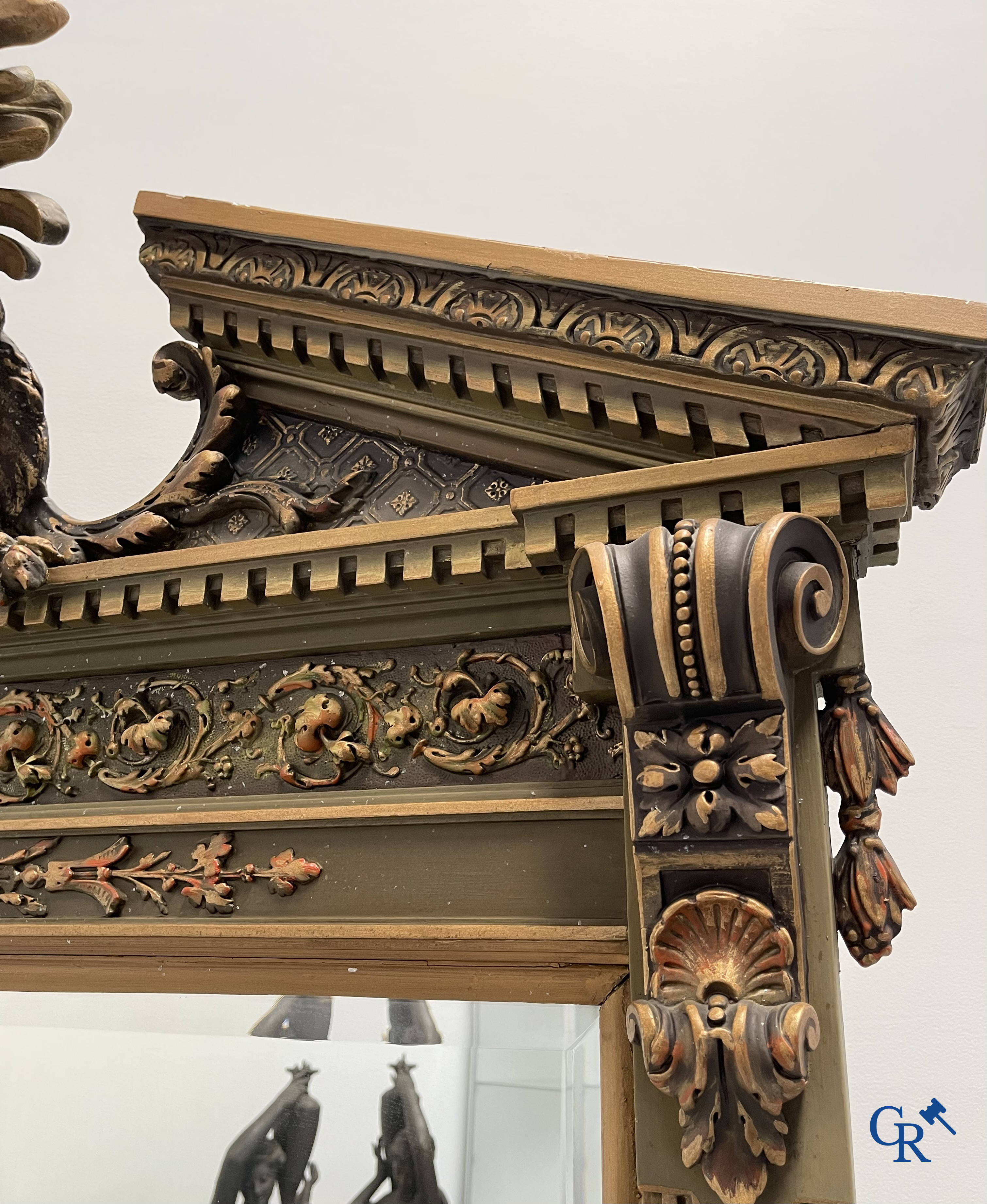 A large patinated fireplace mirror with a dragon. Around 1900.