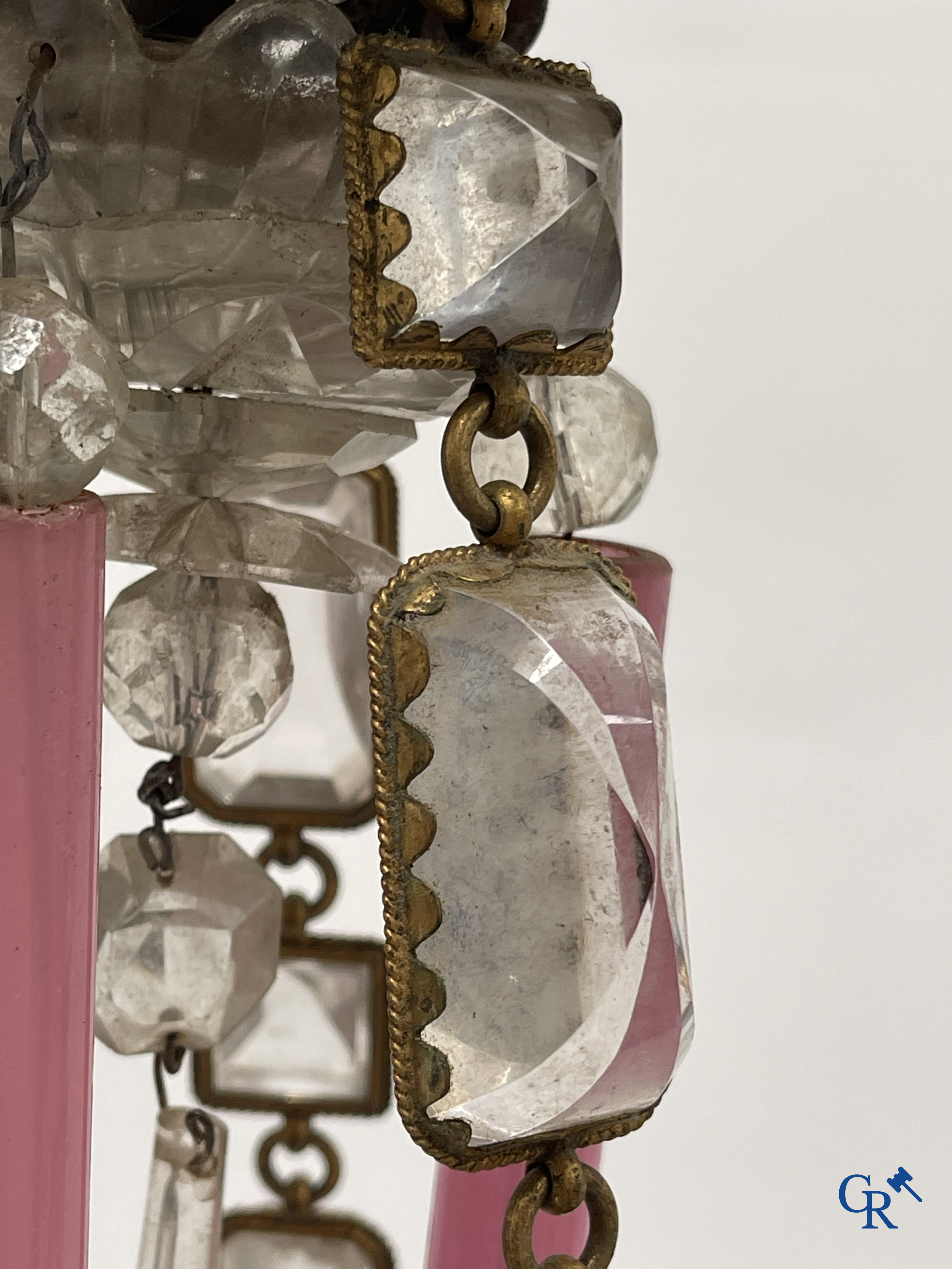 A chandelier in pink opaline and gilded frames with mounted crystal in the style of Baccarat. Circa 1860.