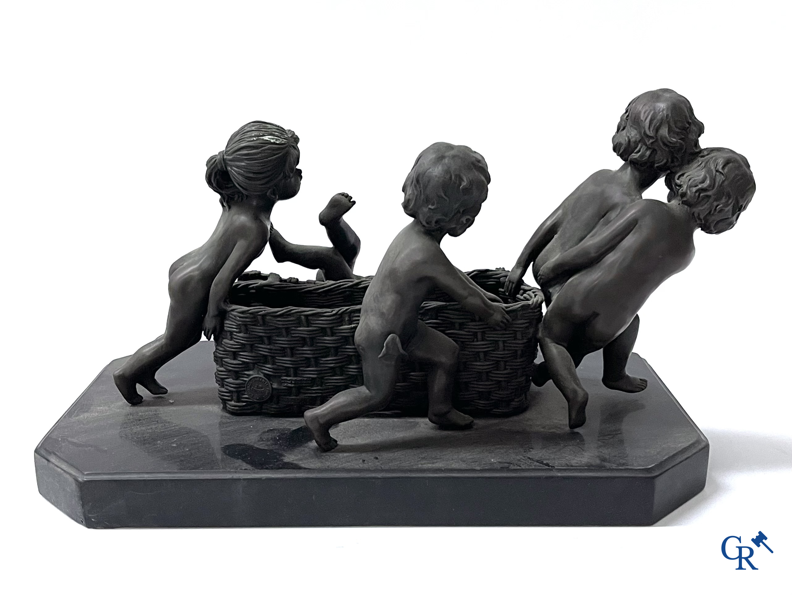 A bronze group after Raoul Larche with 5 children and a basket and 2 bronze statuettes after Chiparus. Posthumous 20th century.
