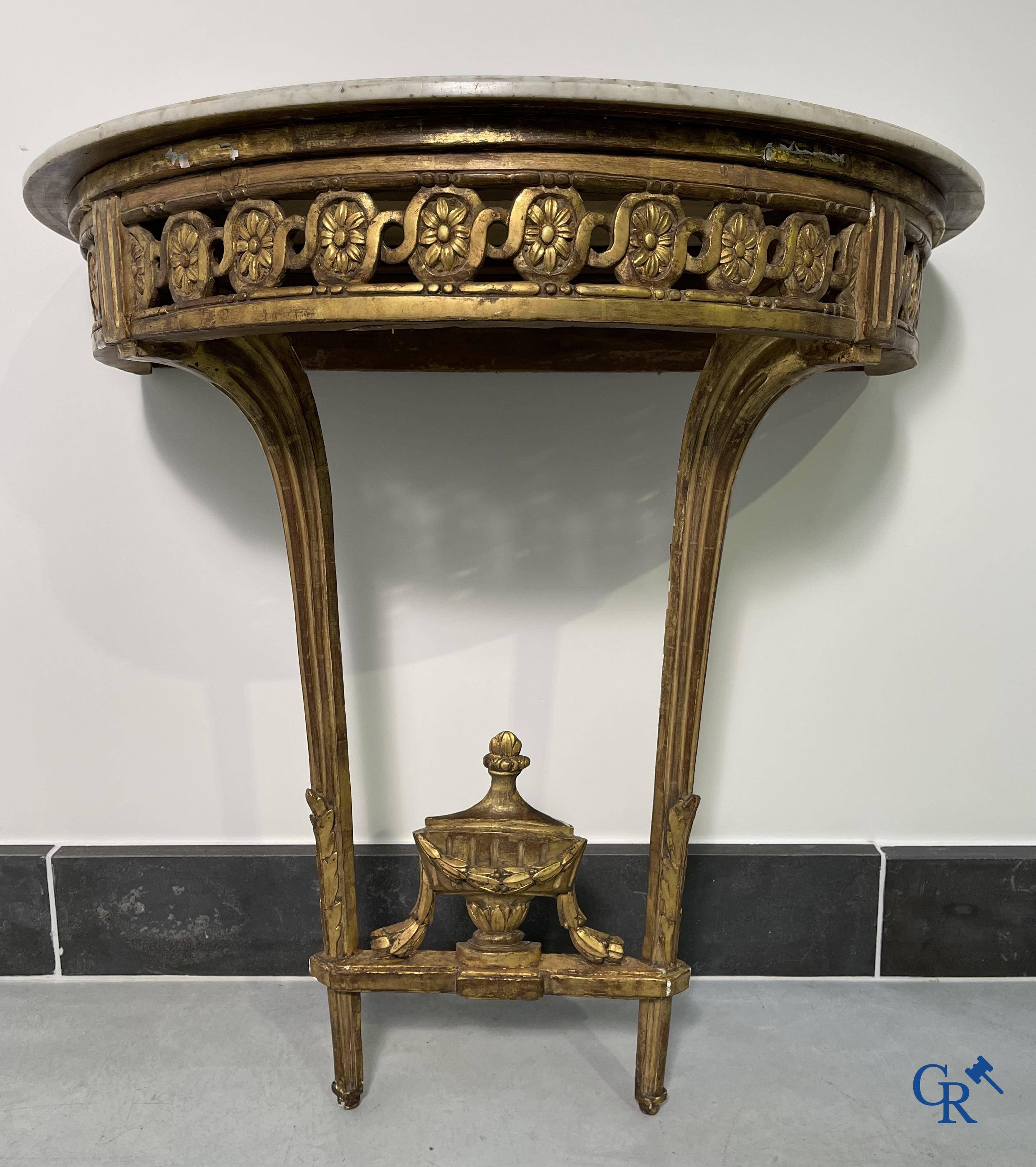 Furniture: Wood sculpted and gilded crescent shaped console. LXVI-period.