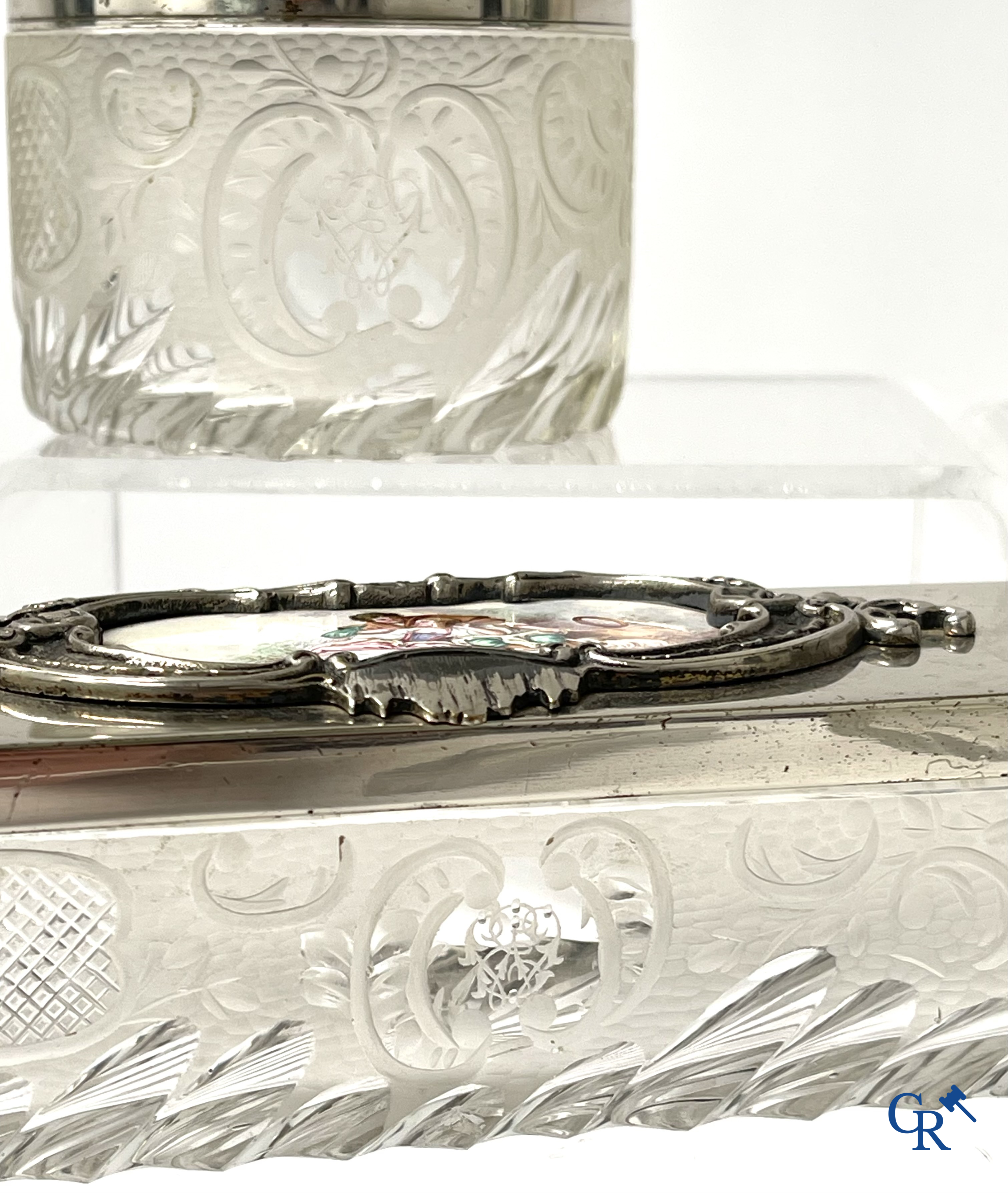 A seven-piece toilet set in silver-plated metal, finely cut crystal and enamelled plaques.