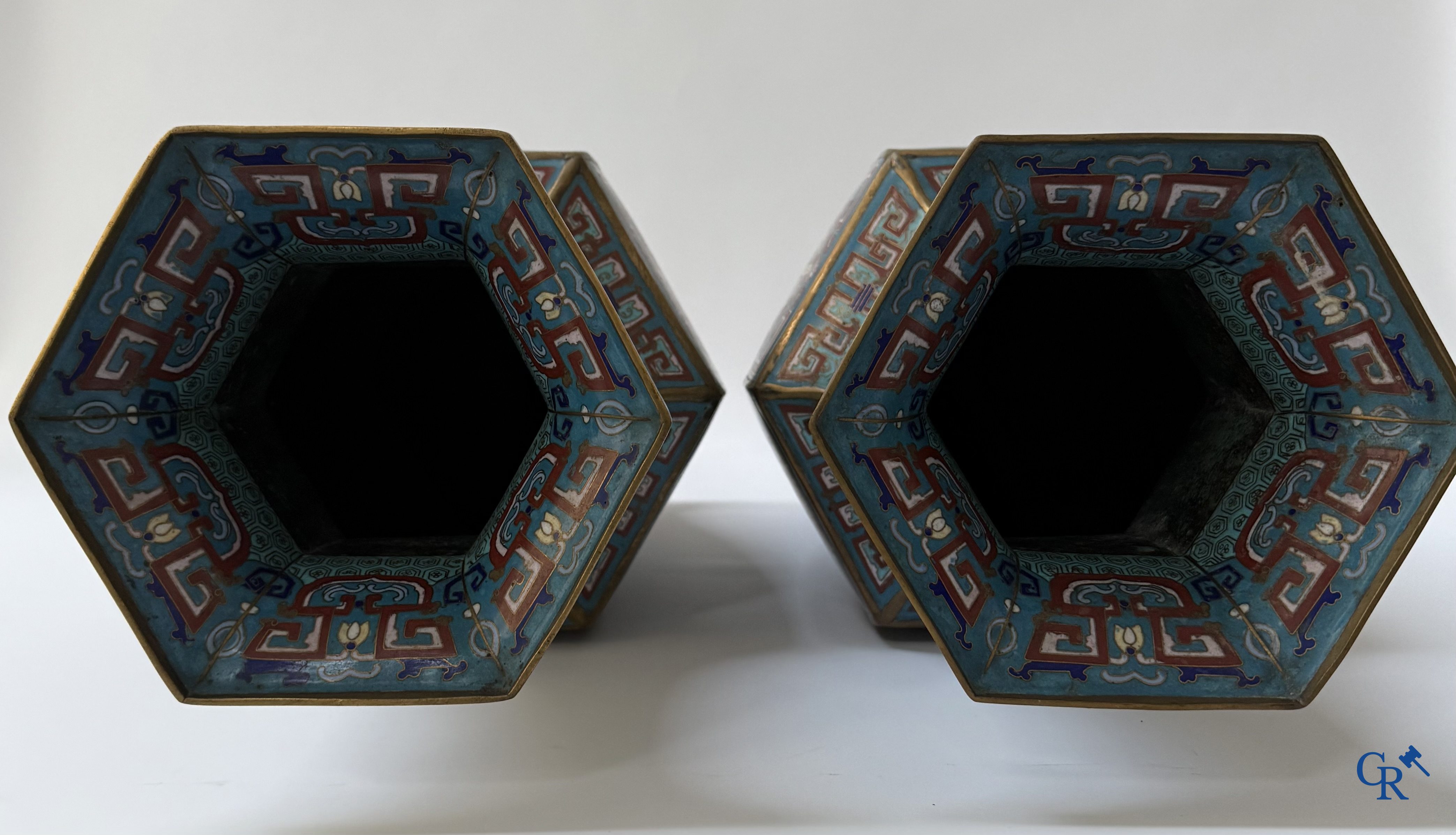 Asian Art, a large pair of hexagonal Chinese cloisonné vases with a decor of antiques.