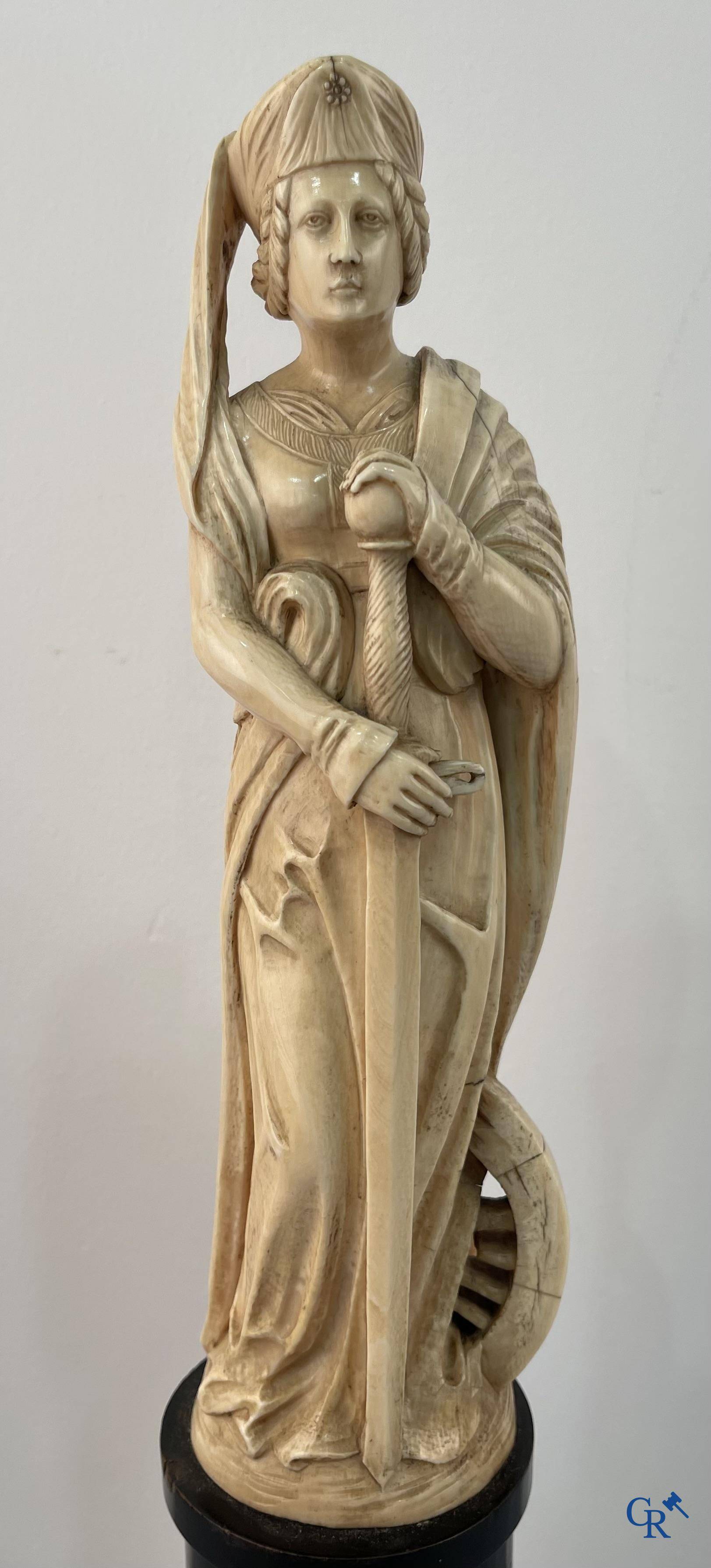 Dieppe, French work, early 19th century. Representation of Catherine of Alexandria in ivory on a pedestal.