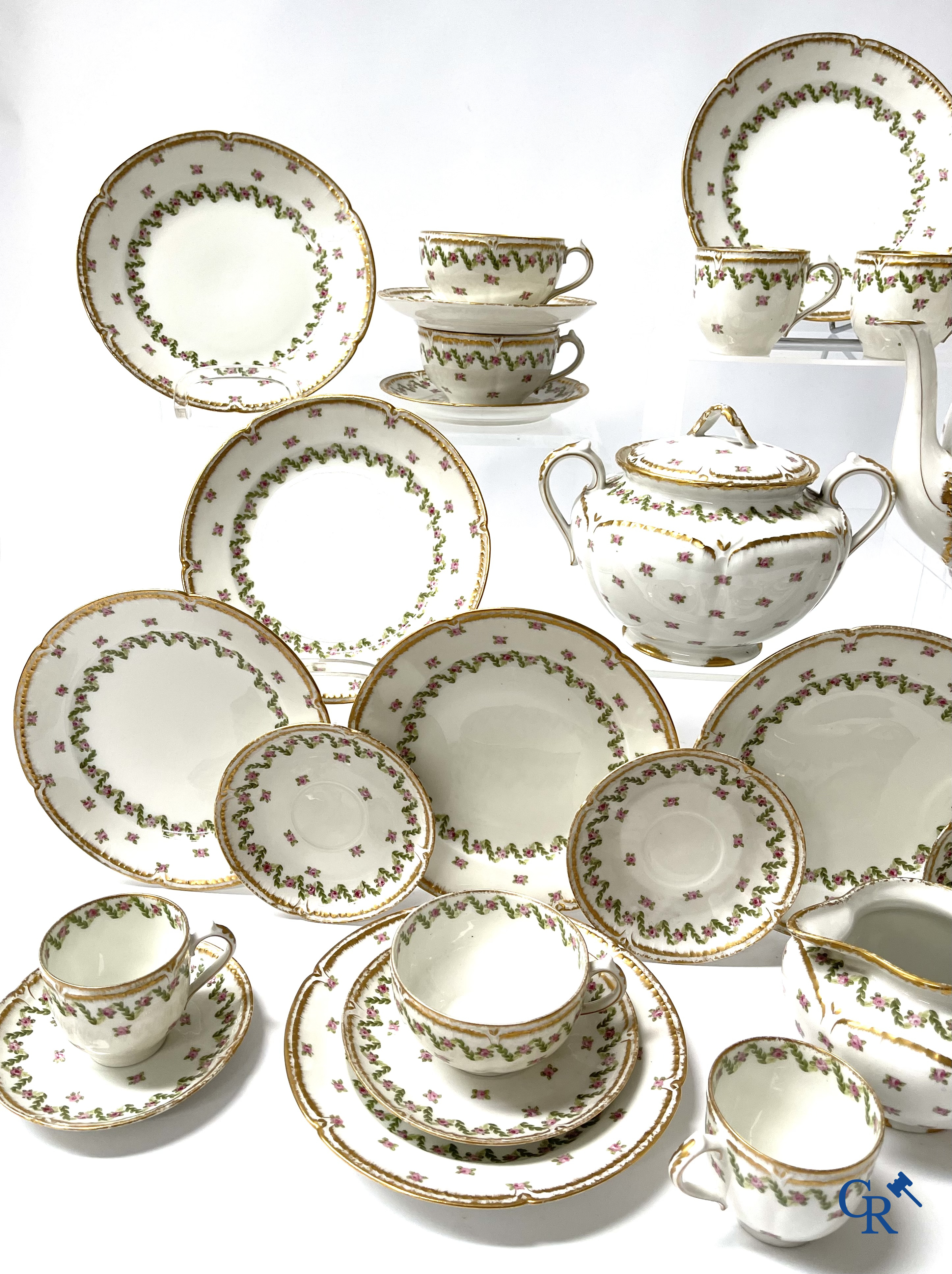 A coffee and tea set with 12 dessert plates in gilded and polychrome decorated French porcelain. Around 1900.