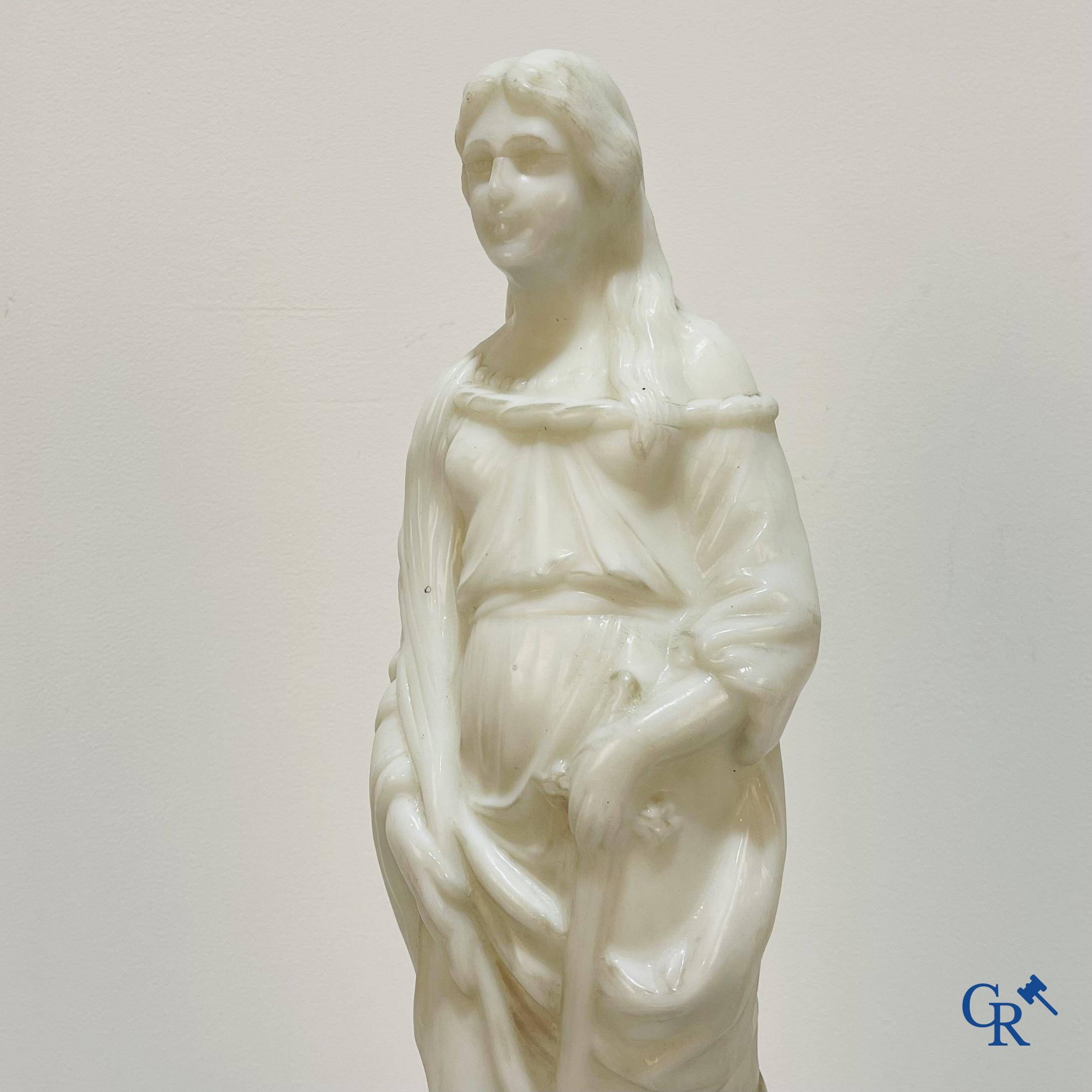 An opaline representation of Saint Catherine on a pedestal. Publicity for Bonbons John Tavernier. Circa 1900.
