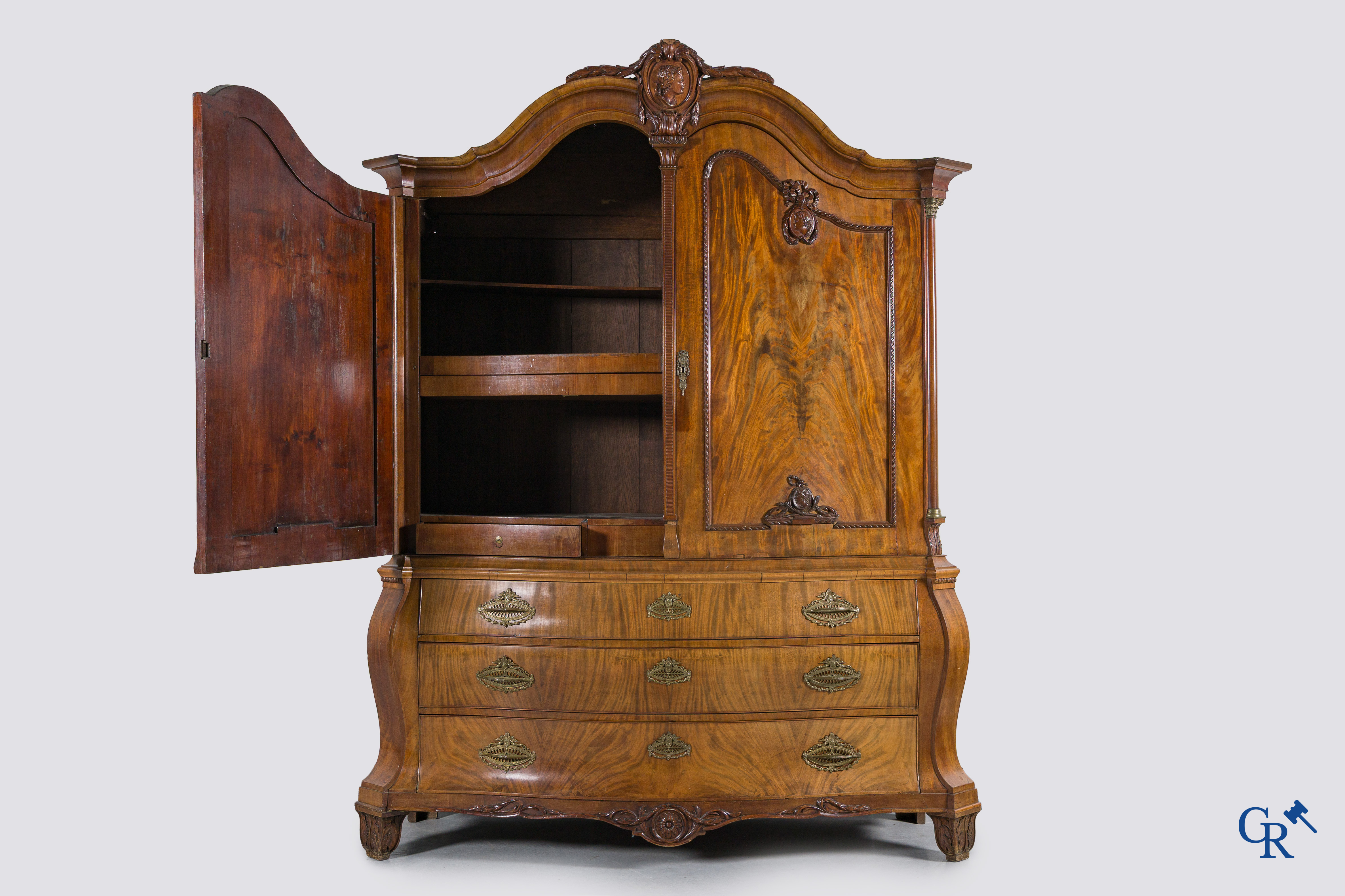 A large mahogany wooden cabinet with 3 drawers and 2 doors decorated with lockets. LXVI style.