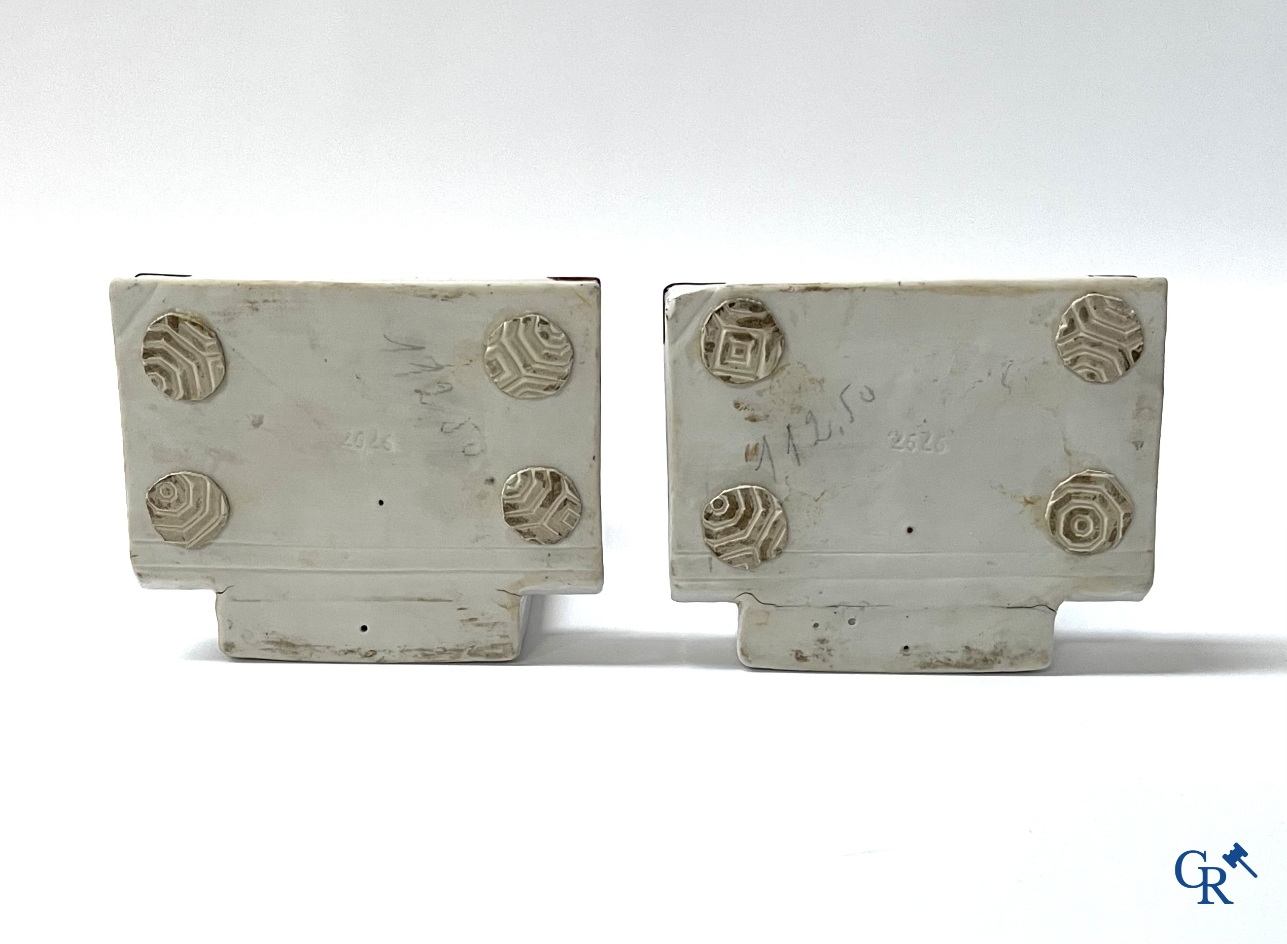 Art Deco, a pair of bookends in polychrome porcelain with a typical Art Deco representation of marabou.