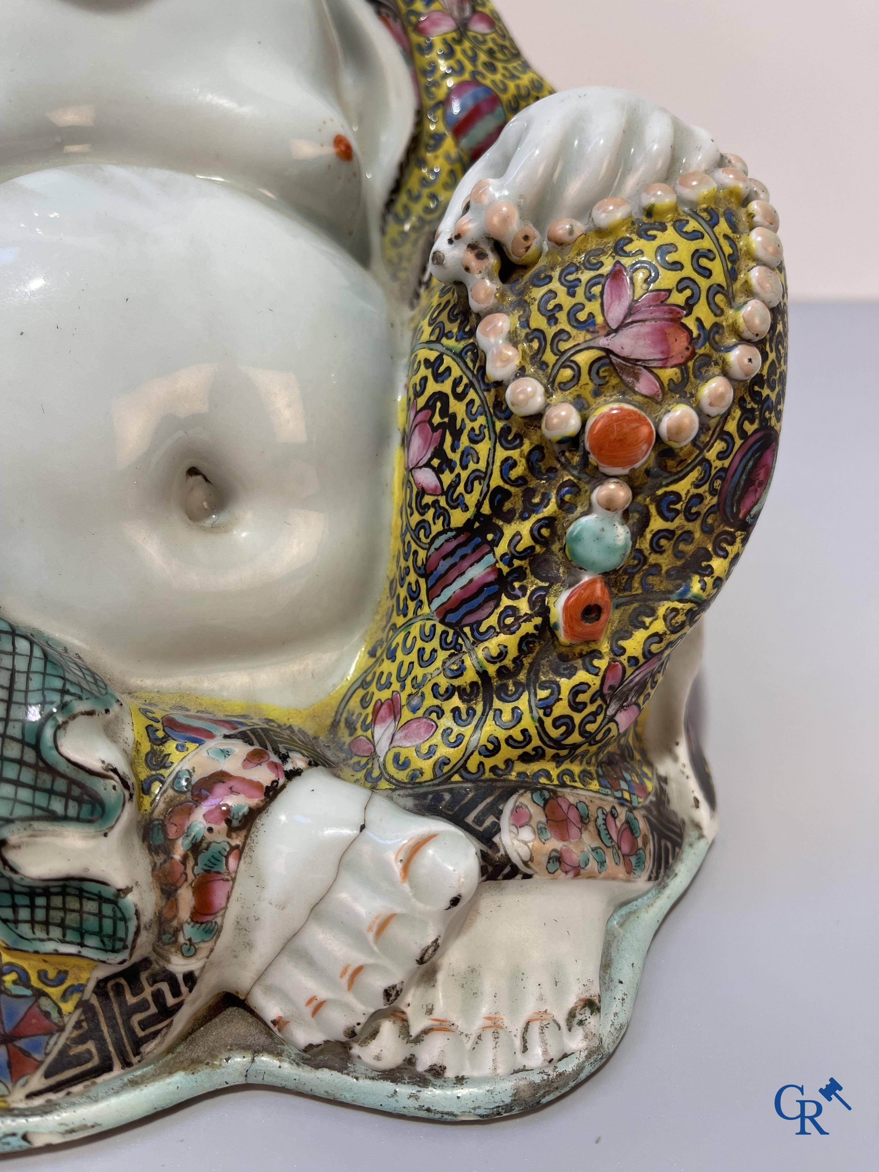 Asian Art, Chinese porcelain. A Chinese famille rose figure of a Buddha with a seal mark. 19th century.
