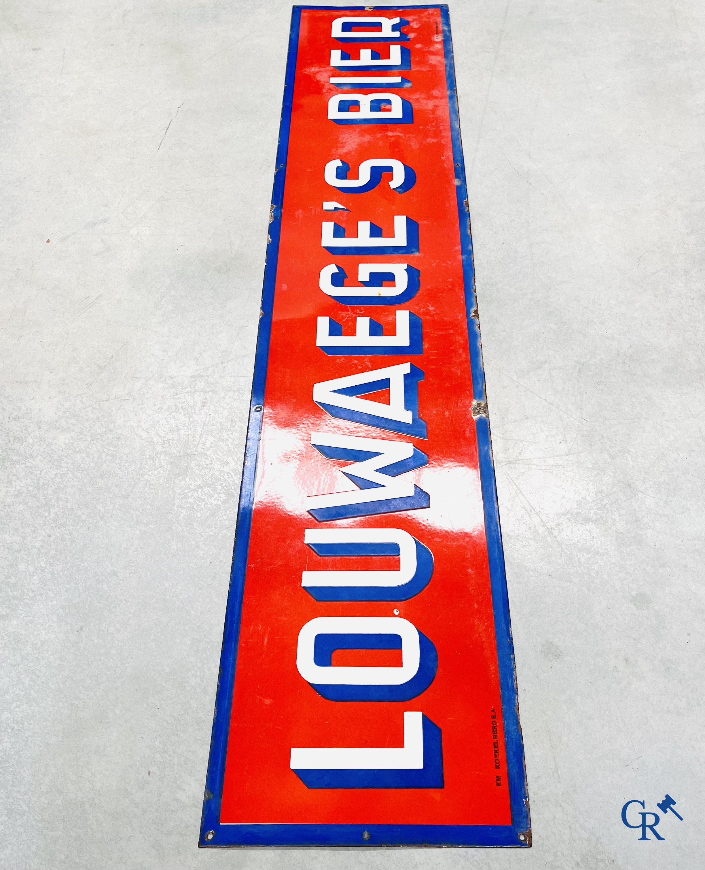 A large enamel advertising sign for Louwaege's beer. Enamel Koekelberg. T.P. Bruxelles 1950.