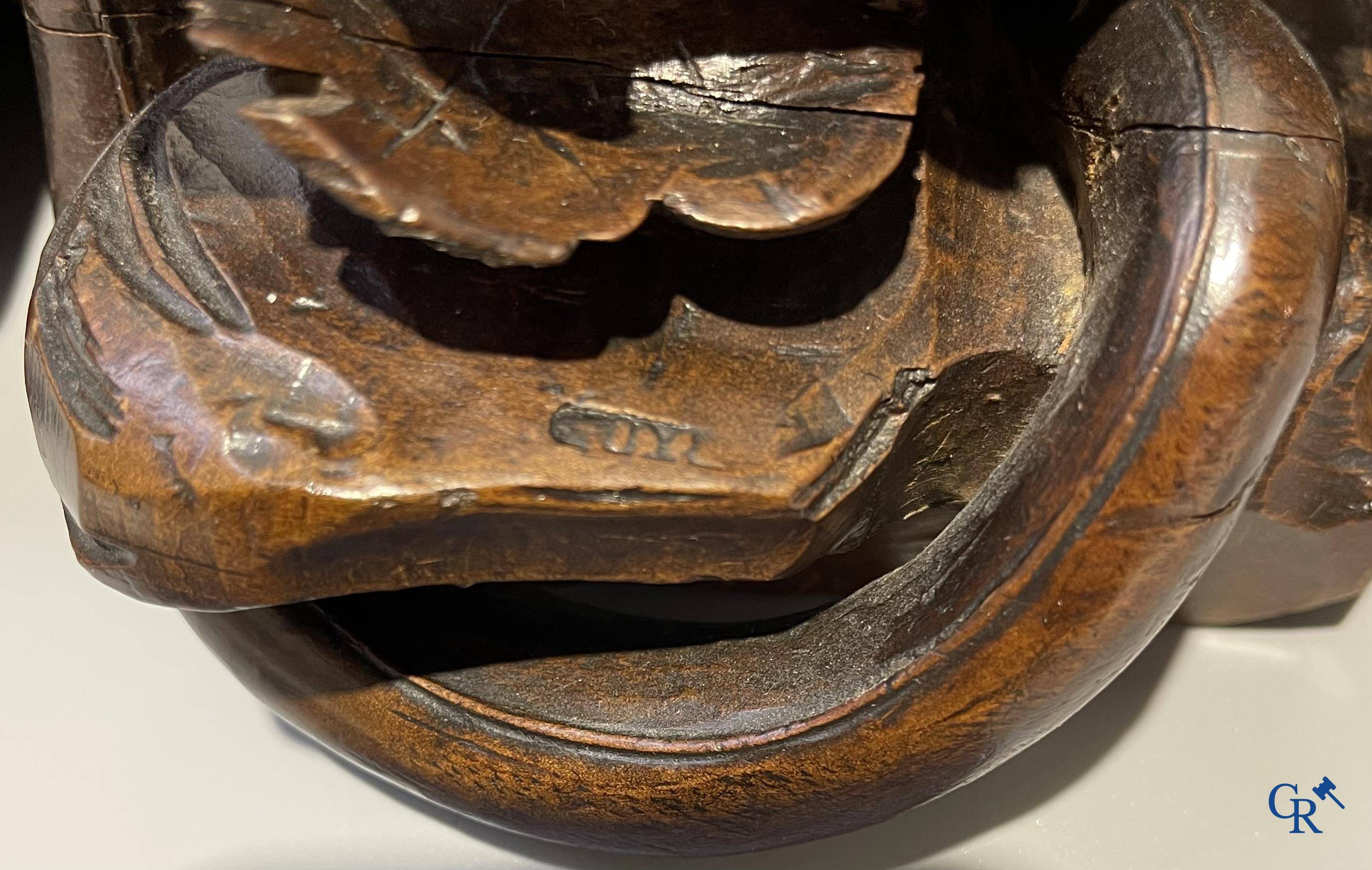 A finely carved walnut clock in so-called "black forest" carving. French work circa 1860-1880.