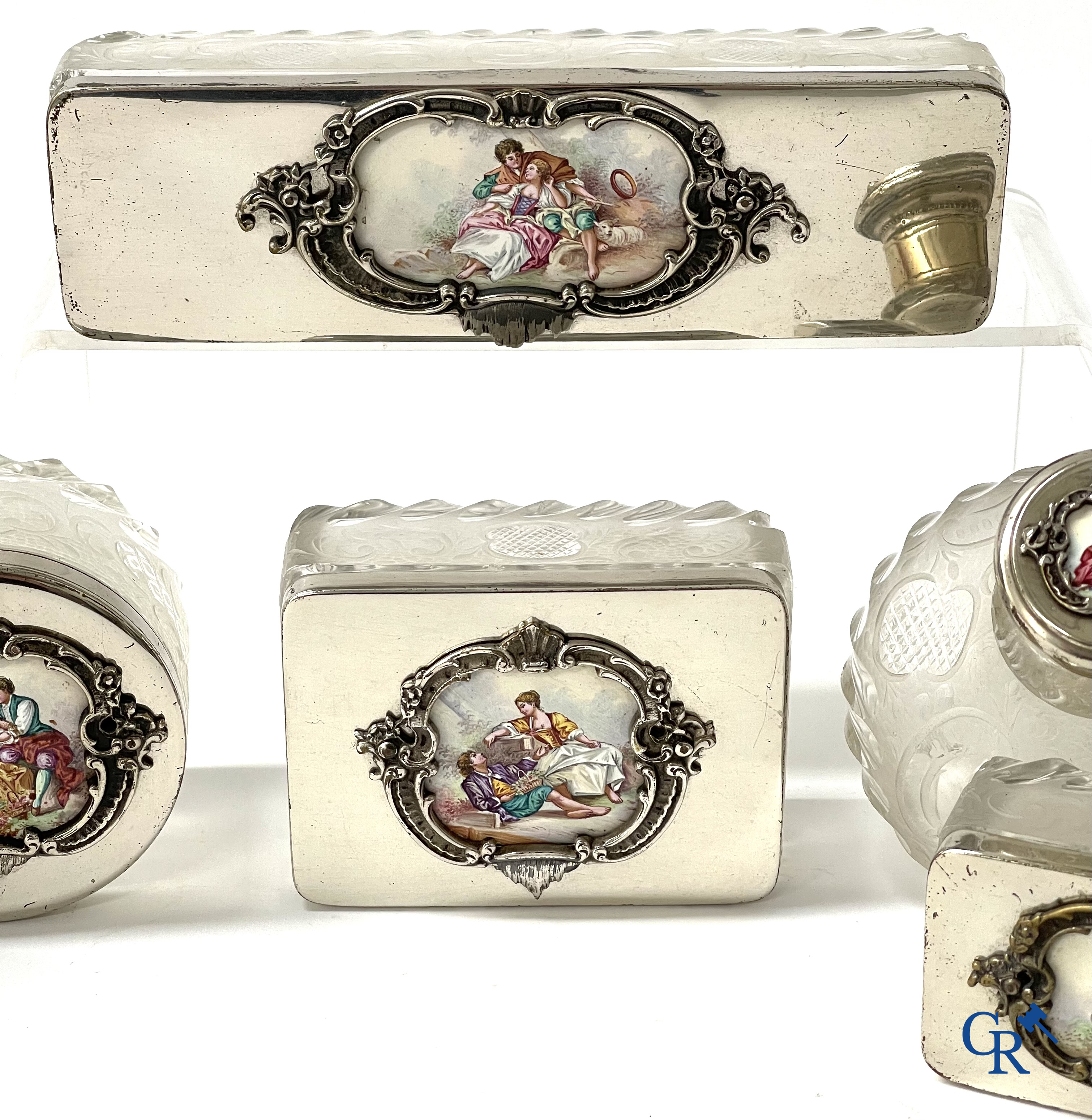 A seven-piece toilet set in silver-plated metal, finely cut crystal and enamelled plaques.