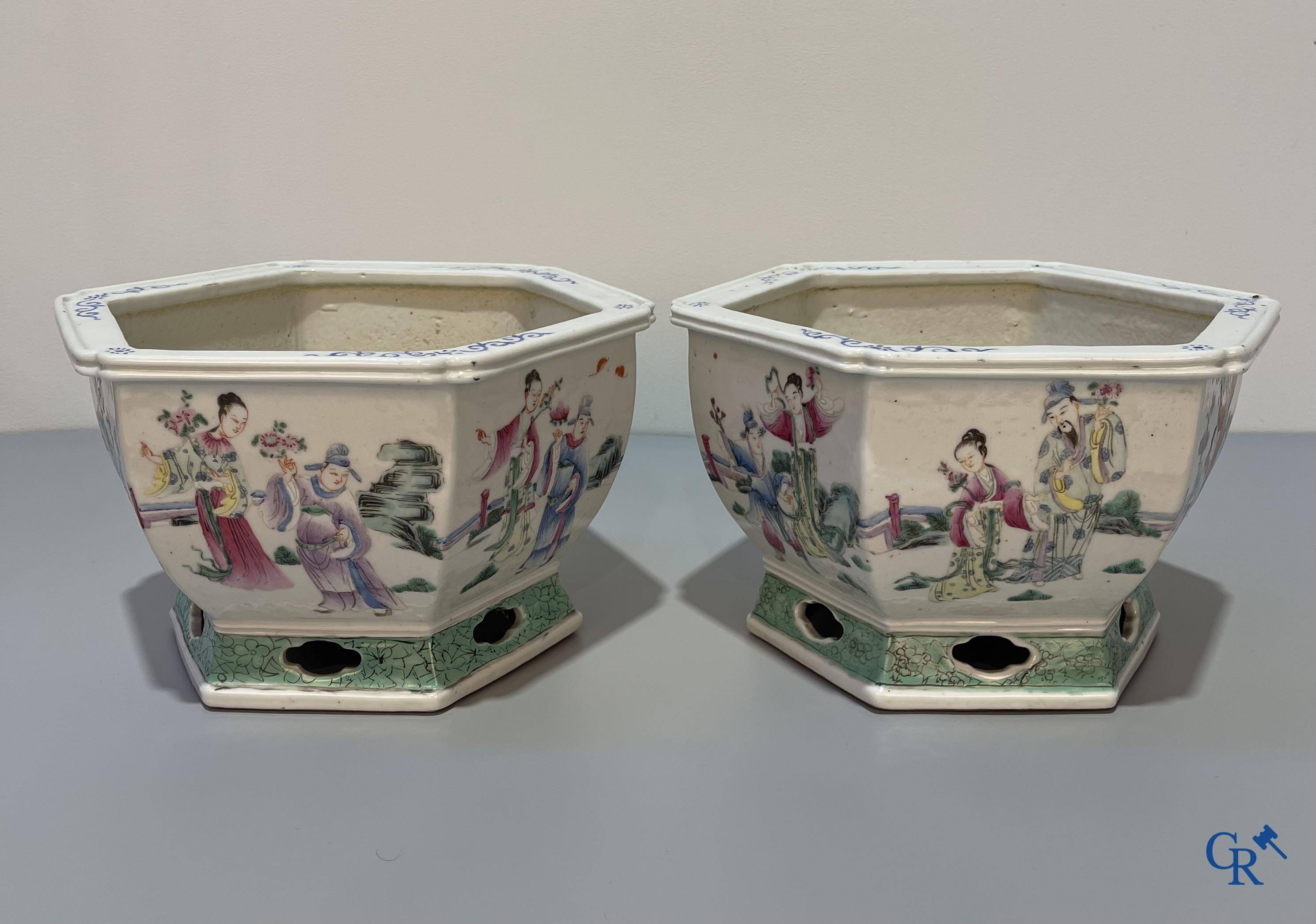 Asian Art, Chinese porcelain, a pair of hexagonal Chinese famille rose jardinieres. 19th century.