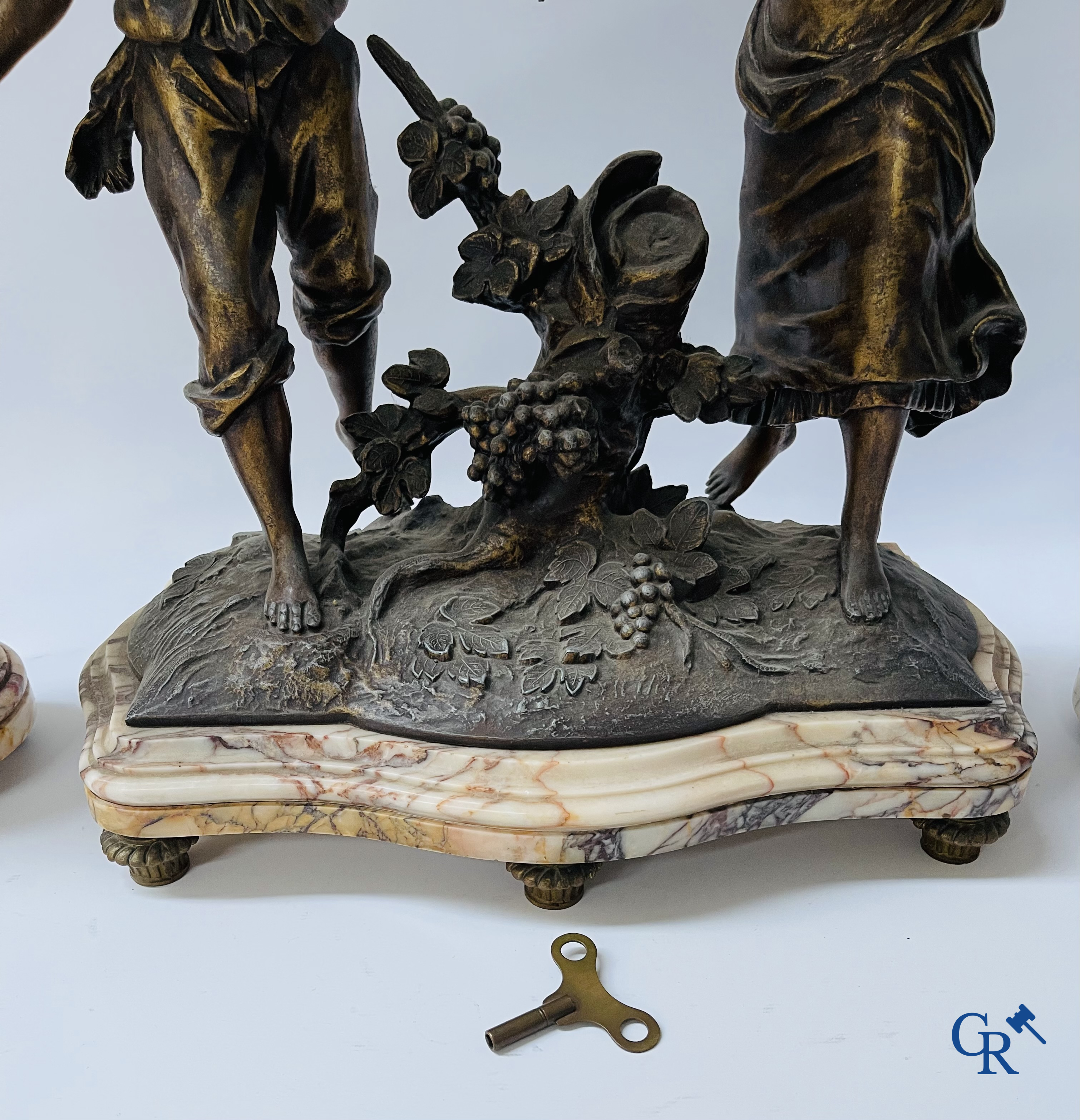 Louis & François Moreau (after). A large 3-piece fireplace set in spelter and marble. Circa 1910.