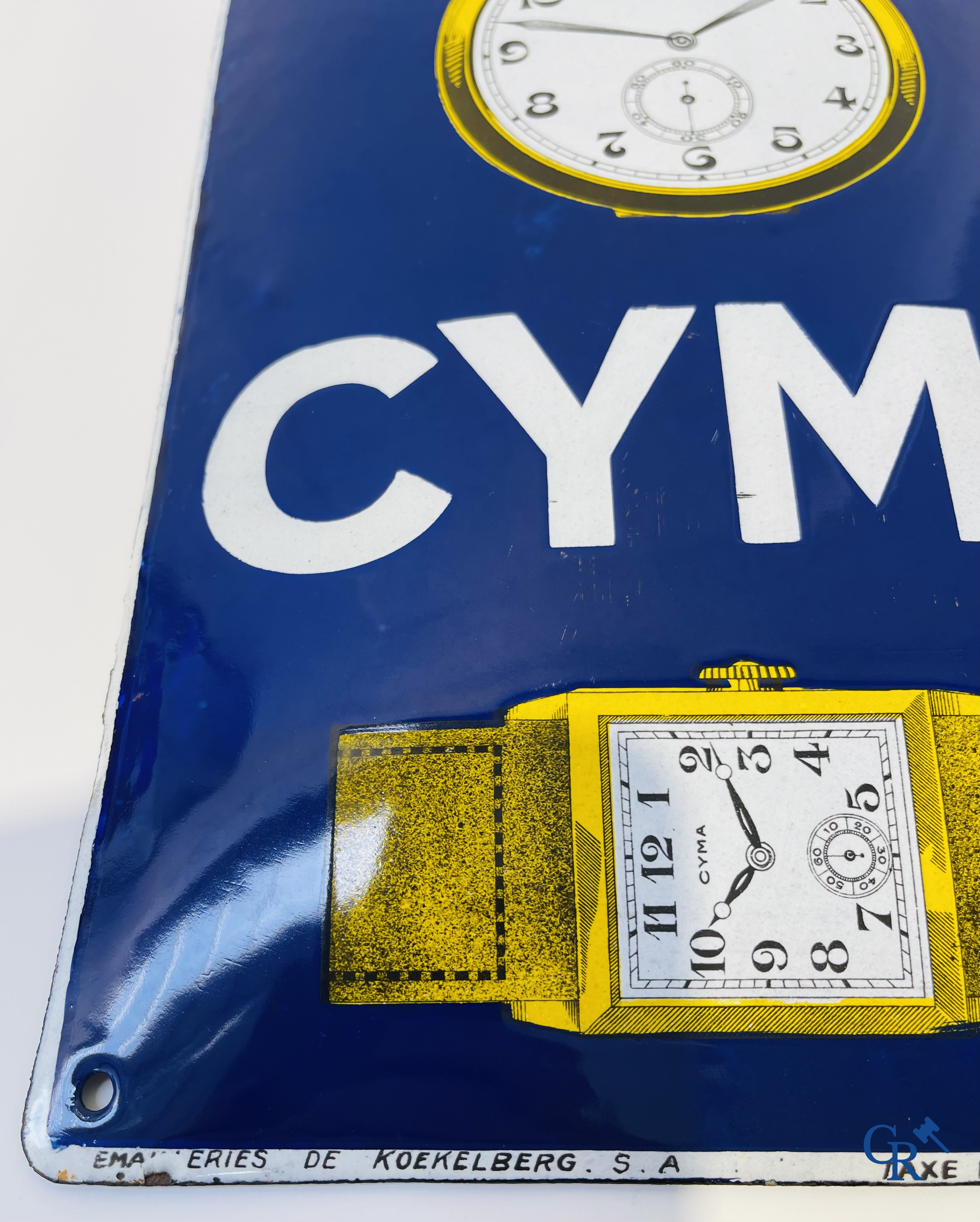 Tavannes Watch Company. Bombed enamel advertising sign for Cyma wrist and pocket watches. 1926.
