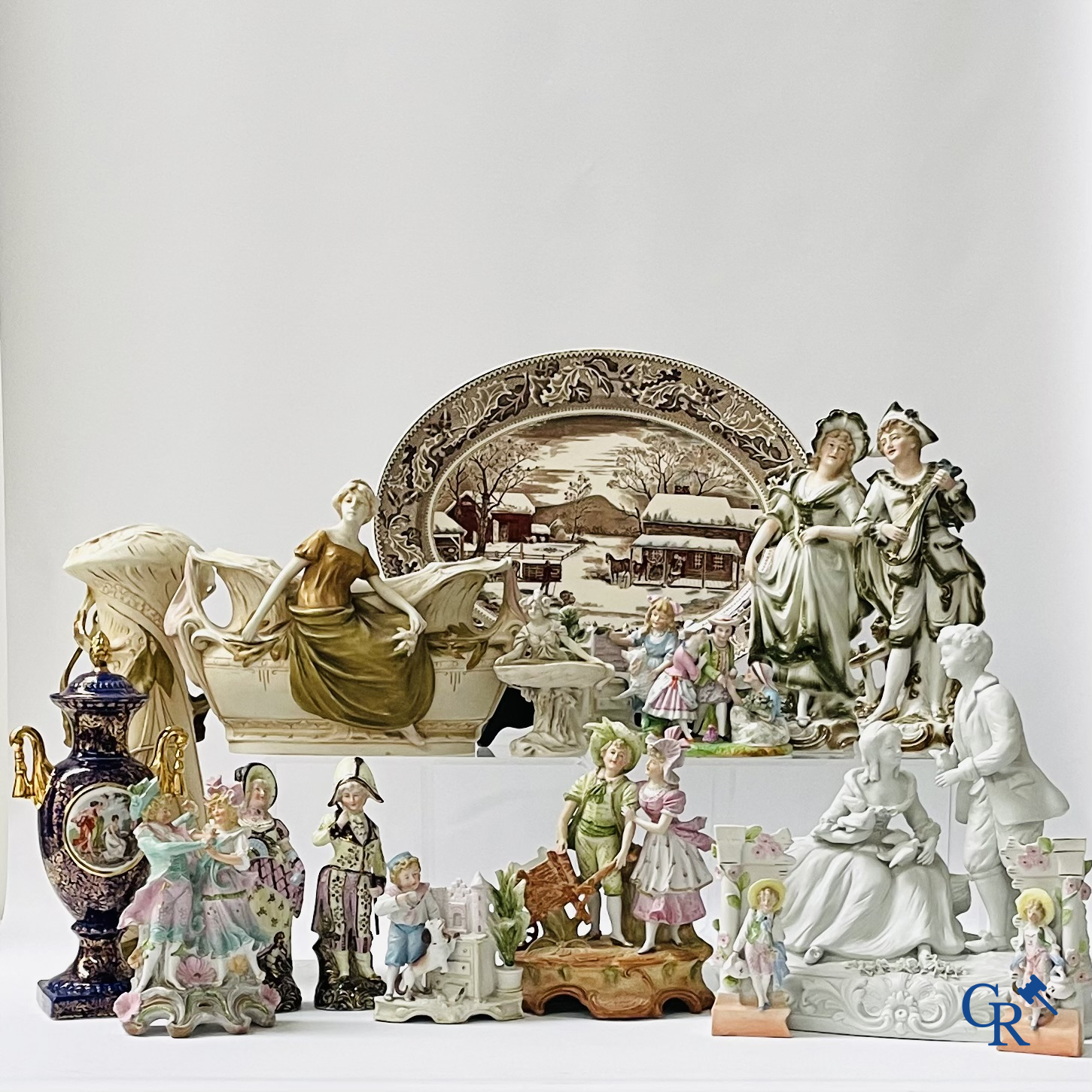 A large lot of brocante including Royal Dux, Biscuit statues, porcelain, globes, spelter statues, table lamp, chandelier etc.