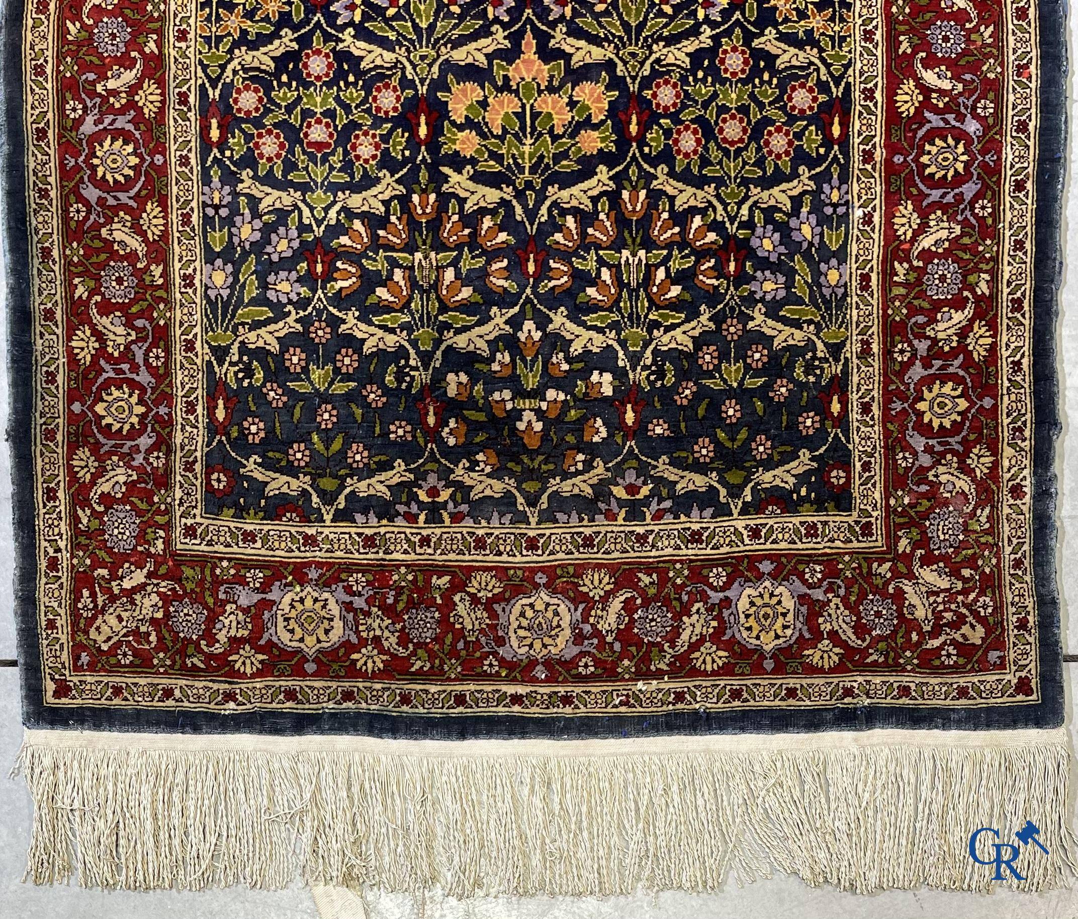 Oriental carpets, a finely hand-knotted silk carpet with floral decor.