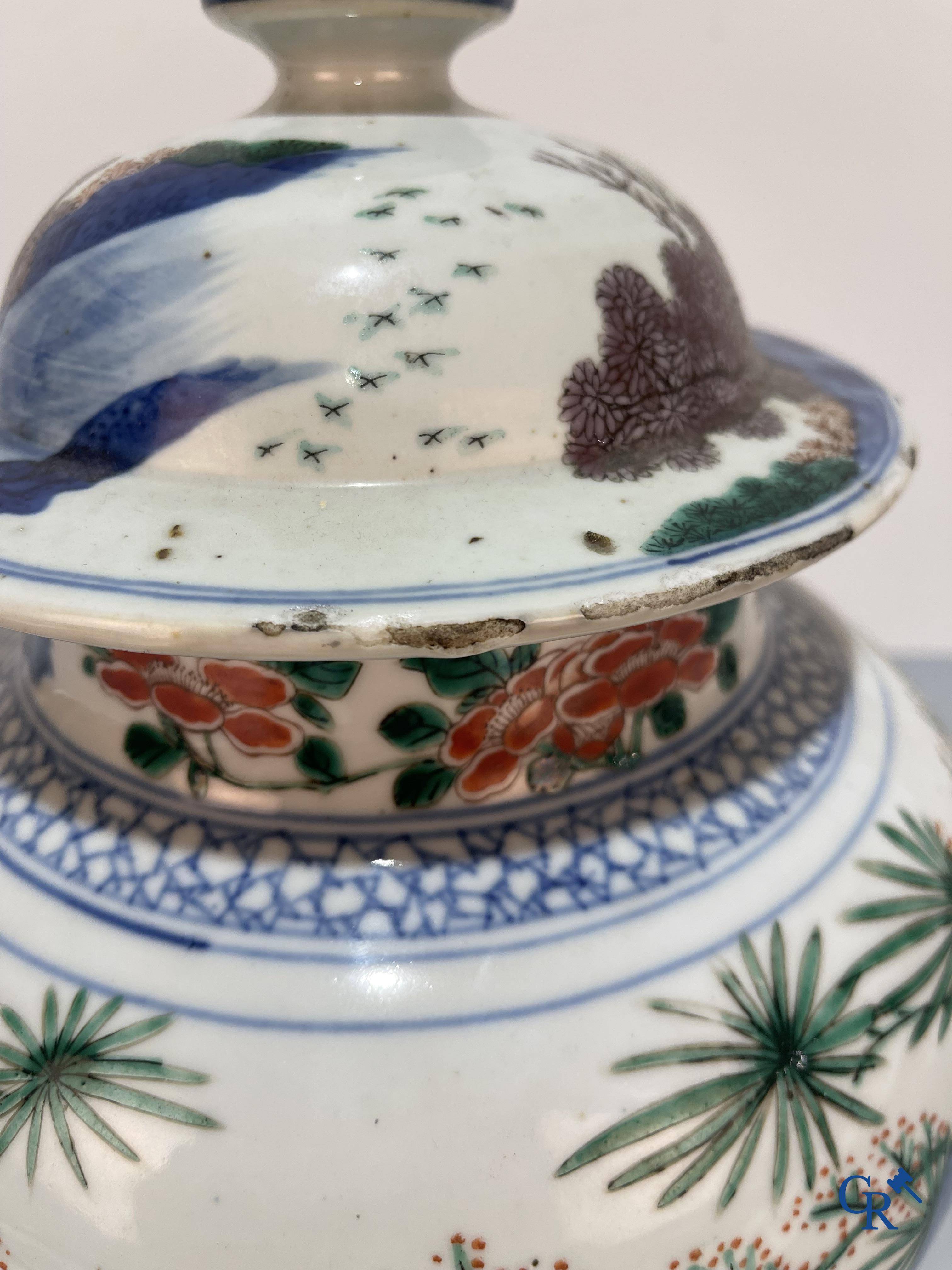 Asian Art, Chinese porcelain, a Chinese Wucai lidded vase with characters.