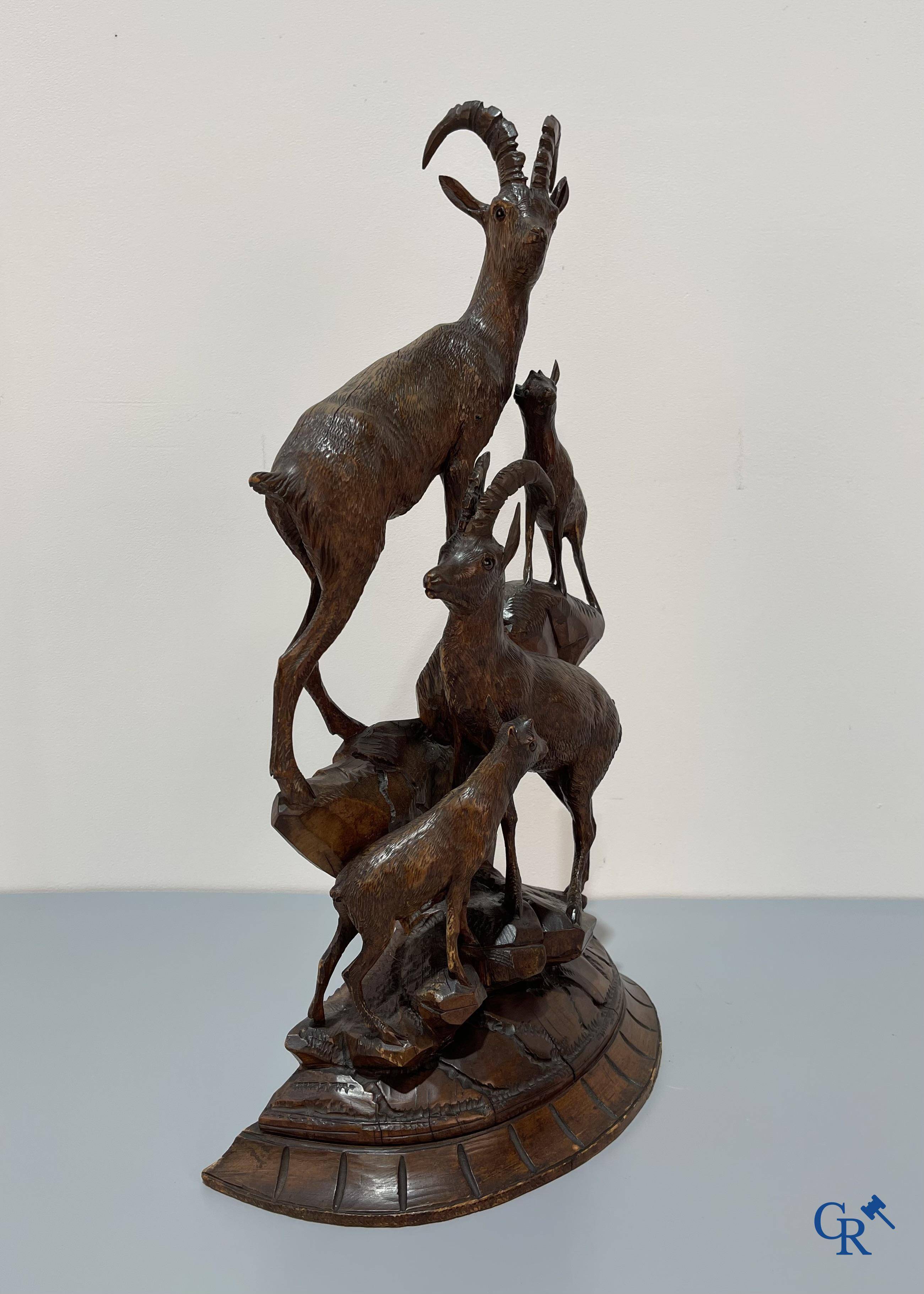 A Black Forest wood sculpture with capricorns, Germany circa 1900.