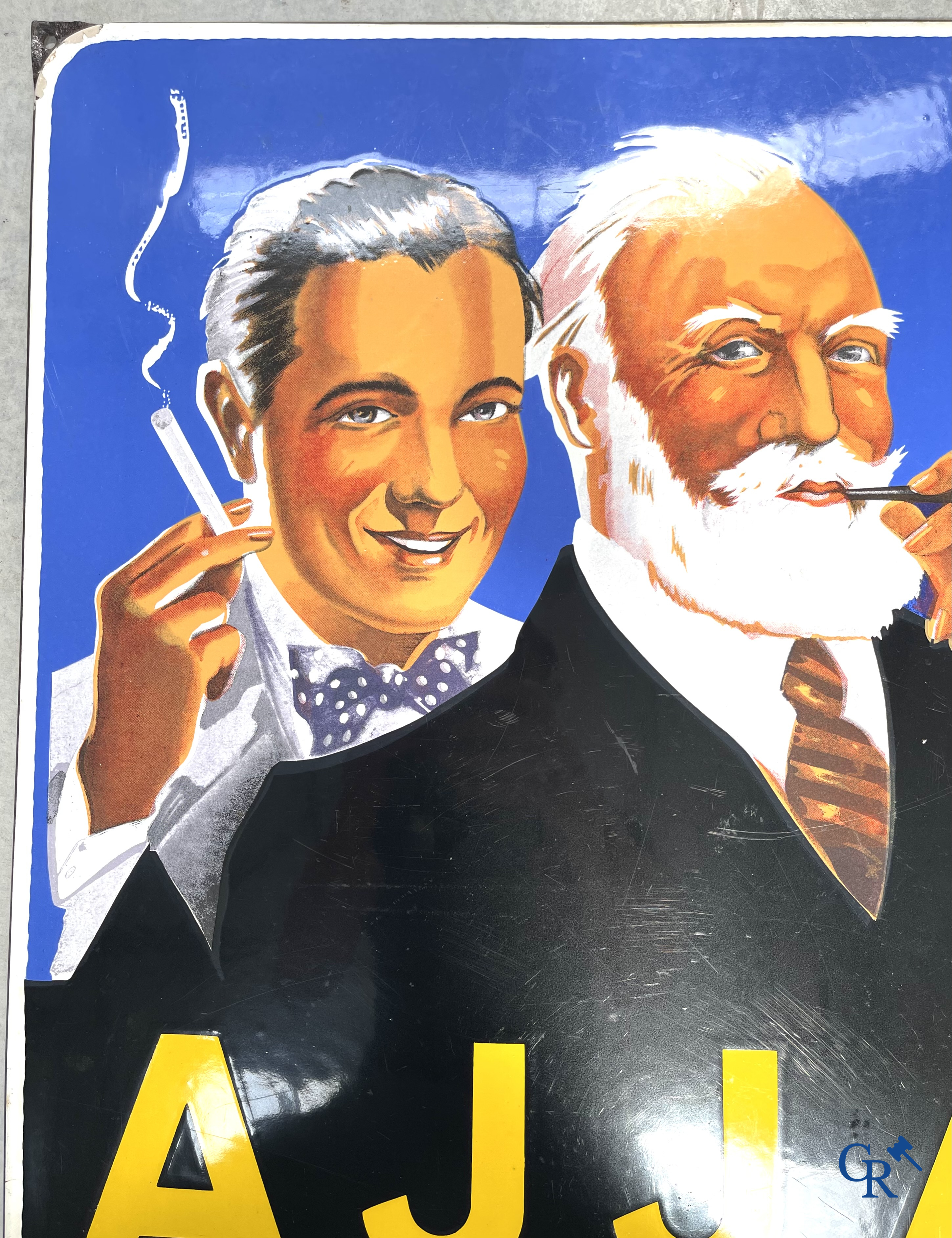 AJJA, Enamel advertising sign for AJJA tobacco products. Emaillerie Odon Warland. T.P. Bruxelles 1952.