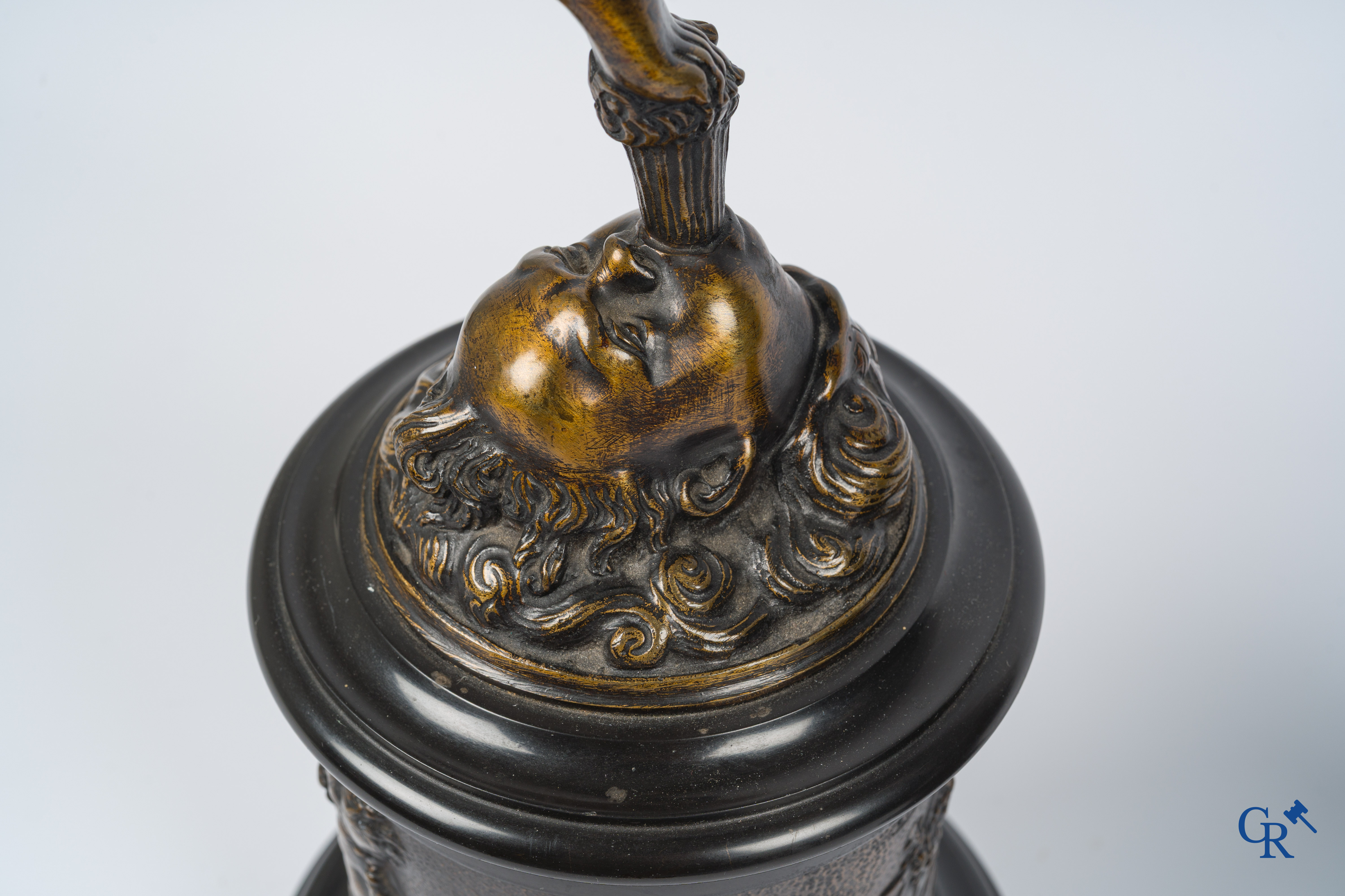 A pair of imposing bronze statues in the antique style after a model by Jean De Bologne.