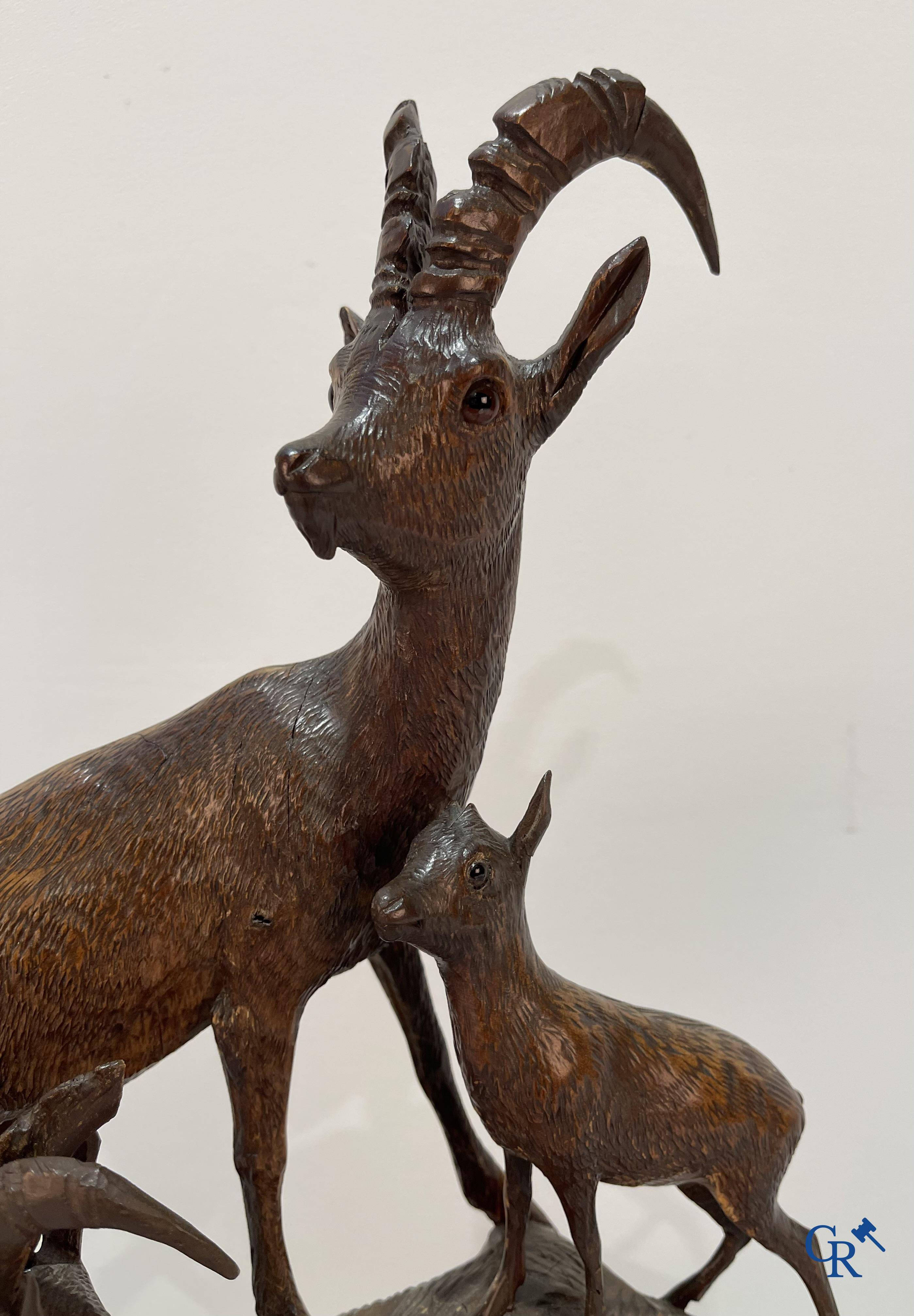 A Black Forest wood sculpture with capricorns, Germany circa 1900.