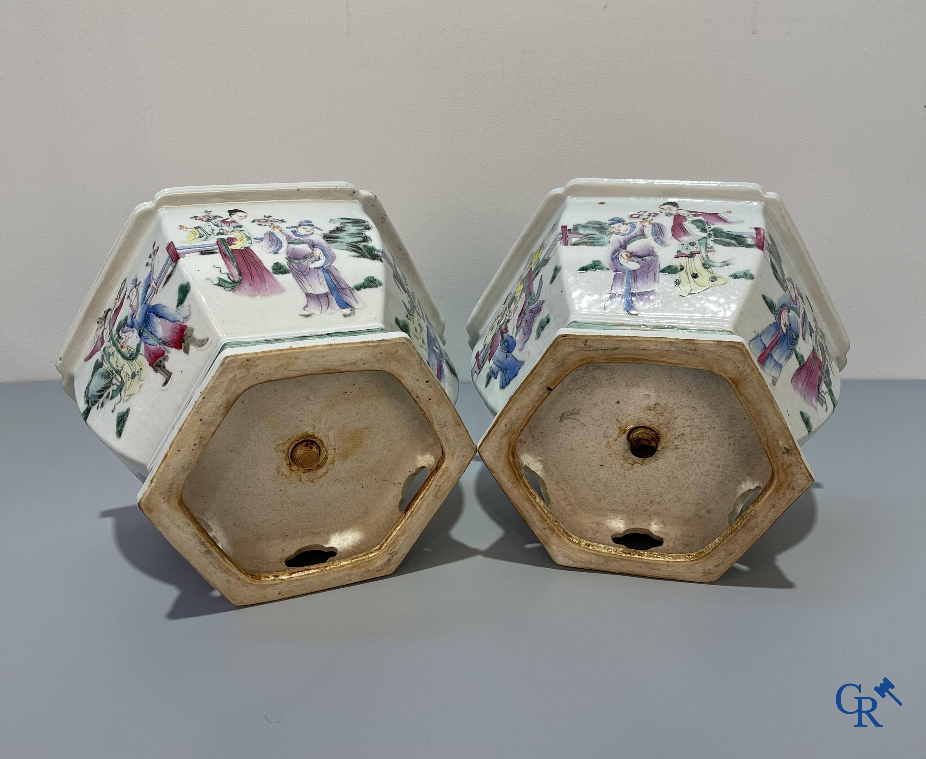 Asian Art, Chinese porcelain, a pair of hexagonal Chinese famille rose jardinieres. 19th century.