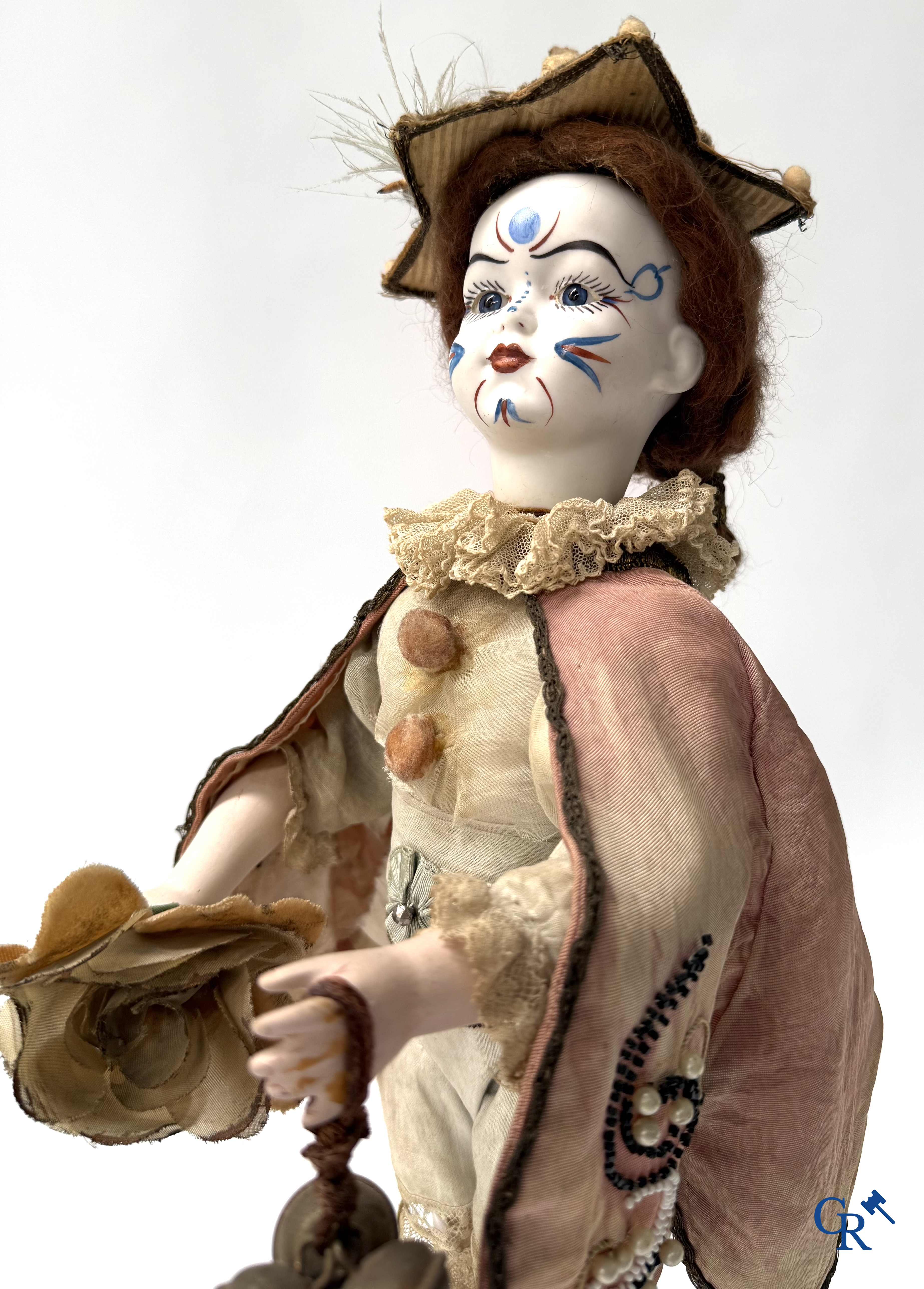 Lambert, Automaat. Clown met bewegingsmechanisme, muziek en porselein hoofd. Circa 1900.